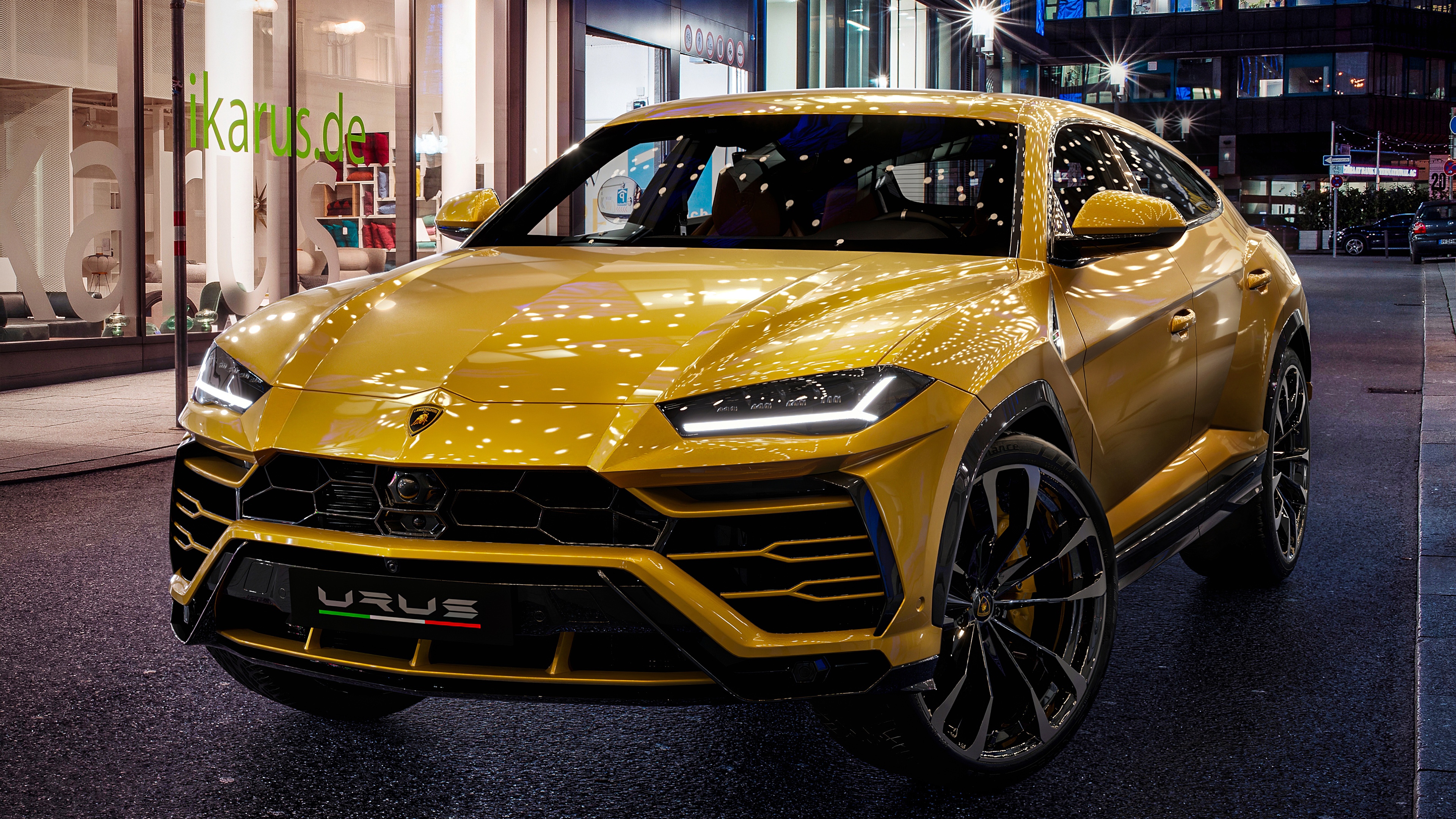 A high-performance Lamborghini Urus super SUV in a dramatic setting.