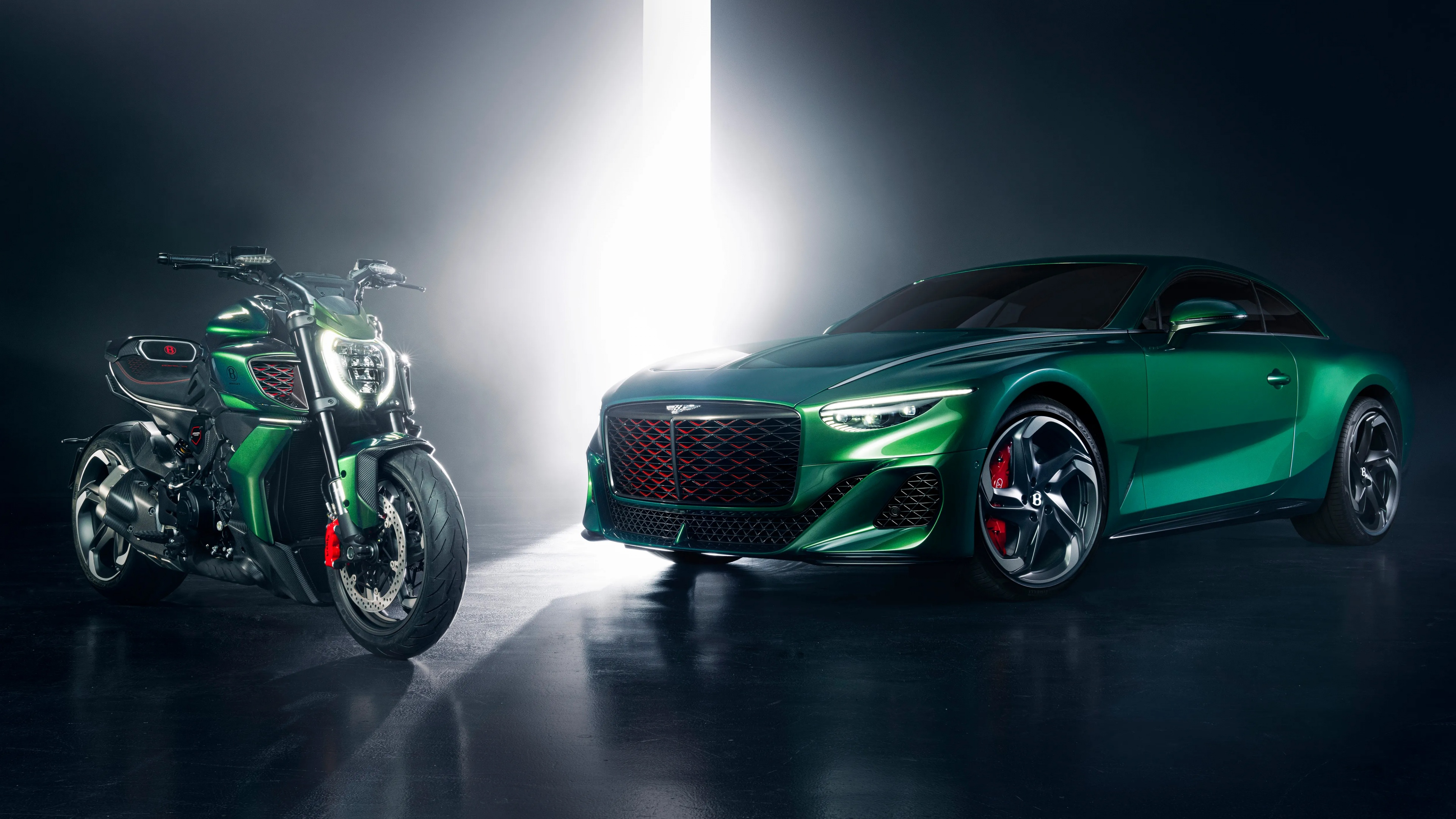 A high-resolution shot of a luxury Bentley Mulliner Batur automobile alongside a specially designed Ducati Diavel for Bentley motorcycle.