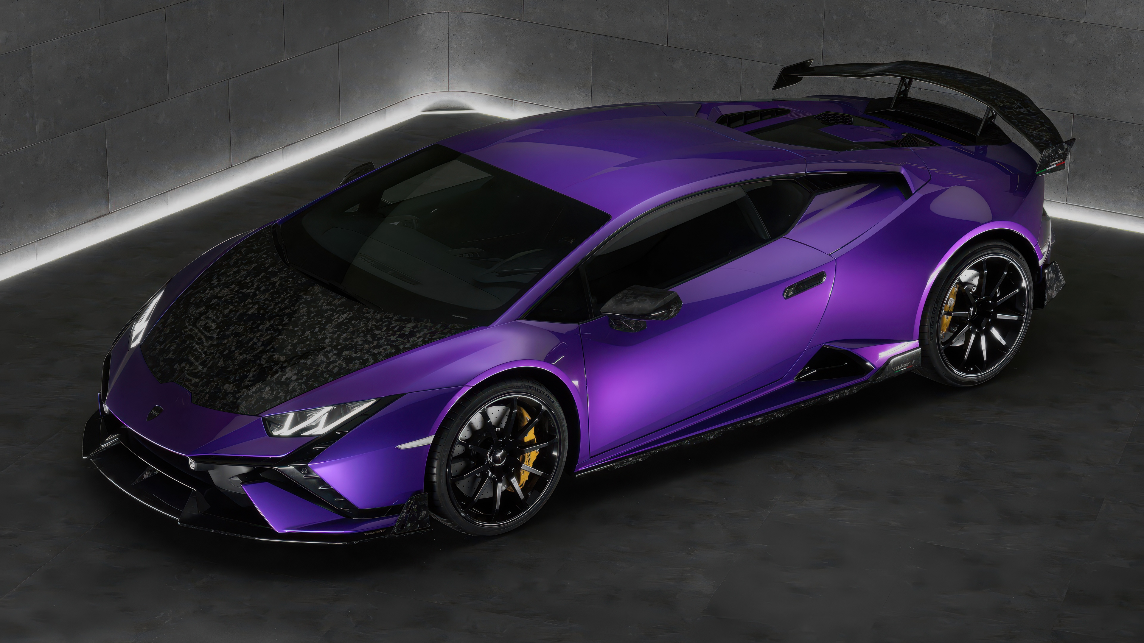 A high-detail view of a Mansory-tuned Lamborghini Huracán Tecnica with aggressive widebody styling and premium finishes.