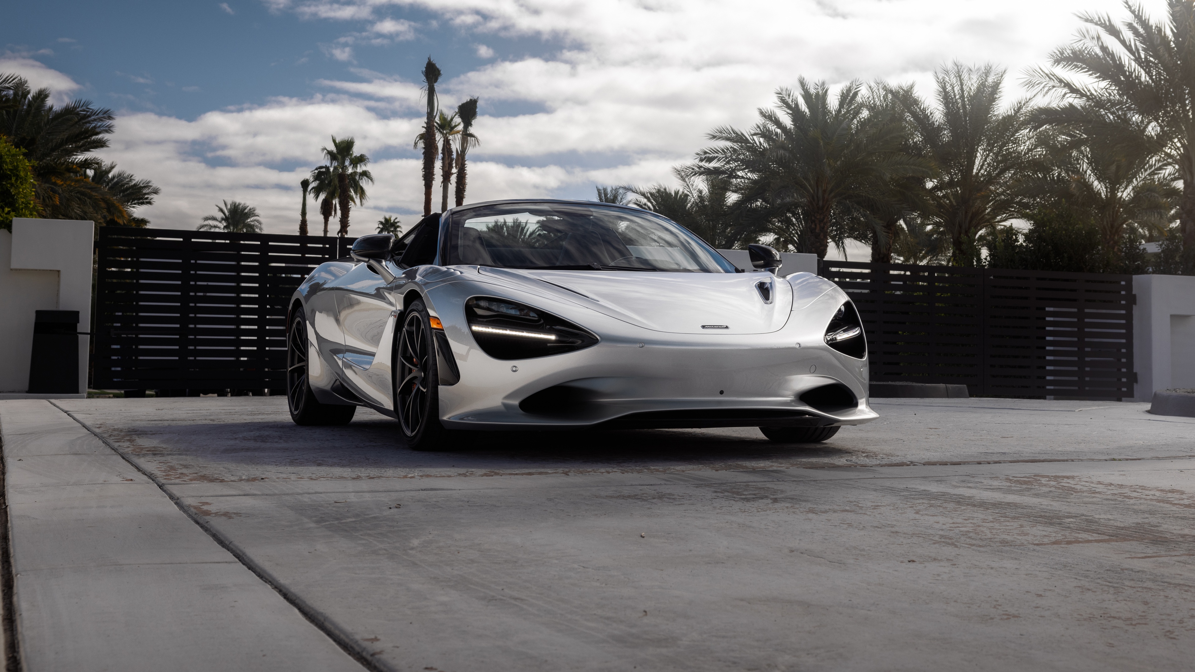 A high-detail, professional shot of a McLaren 750S Spider supercar showcasing its sleek aerodynamic lines and convertible design.