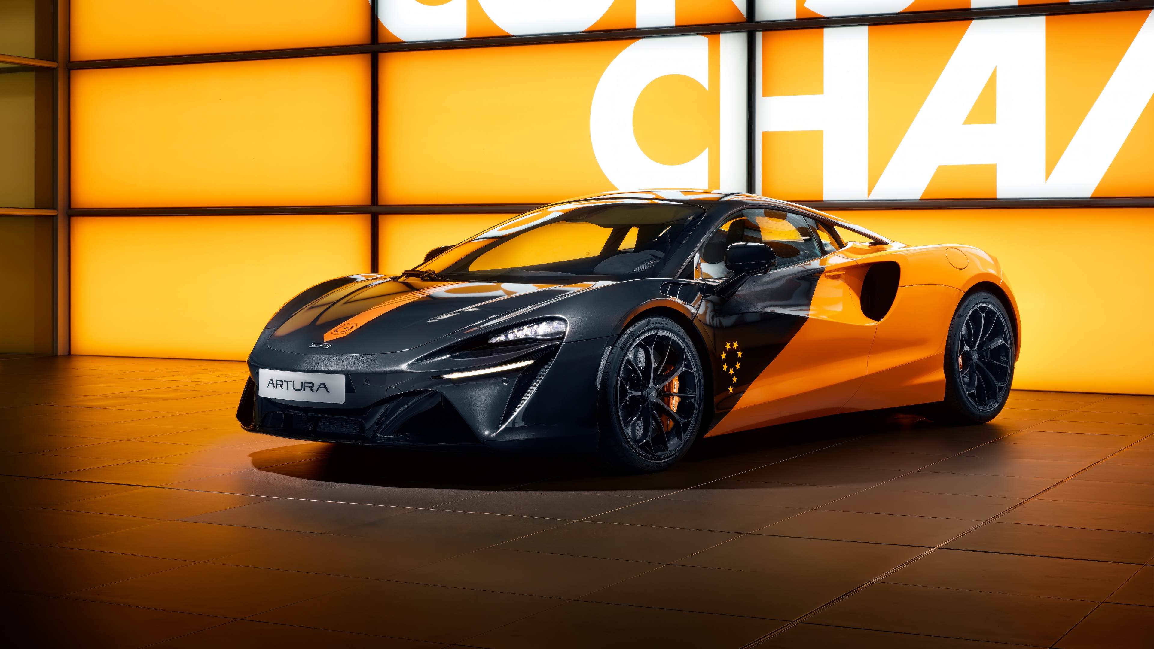 A high-detail 5K rendering of the McLaren MCL38 racing car and the McLaren Artura supercar.