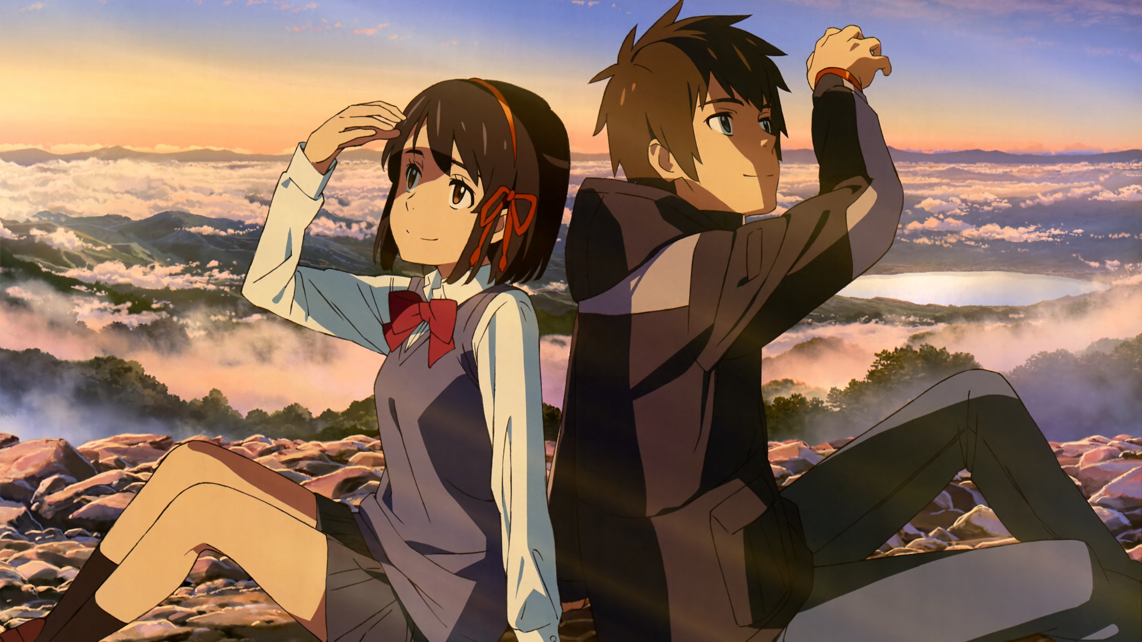 An anime illustration of Mitsuha Miyamizu and Taki Tachibana from the movie Your Name.