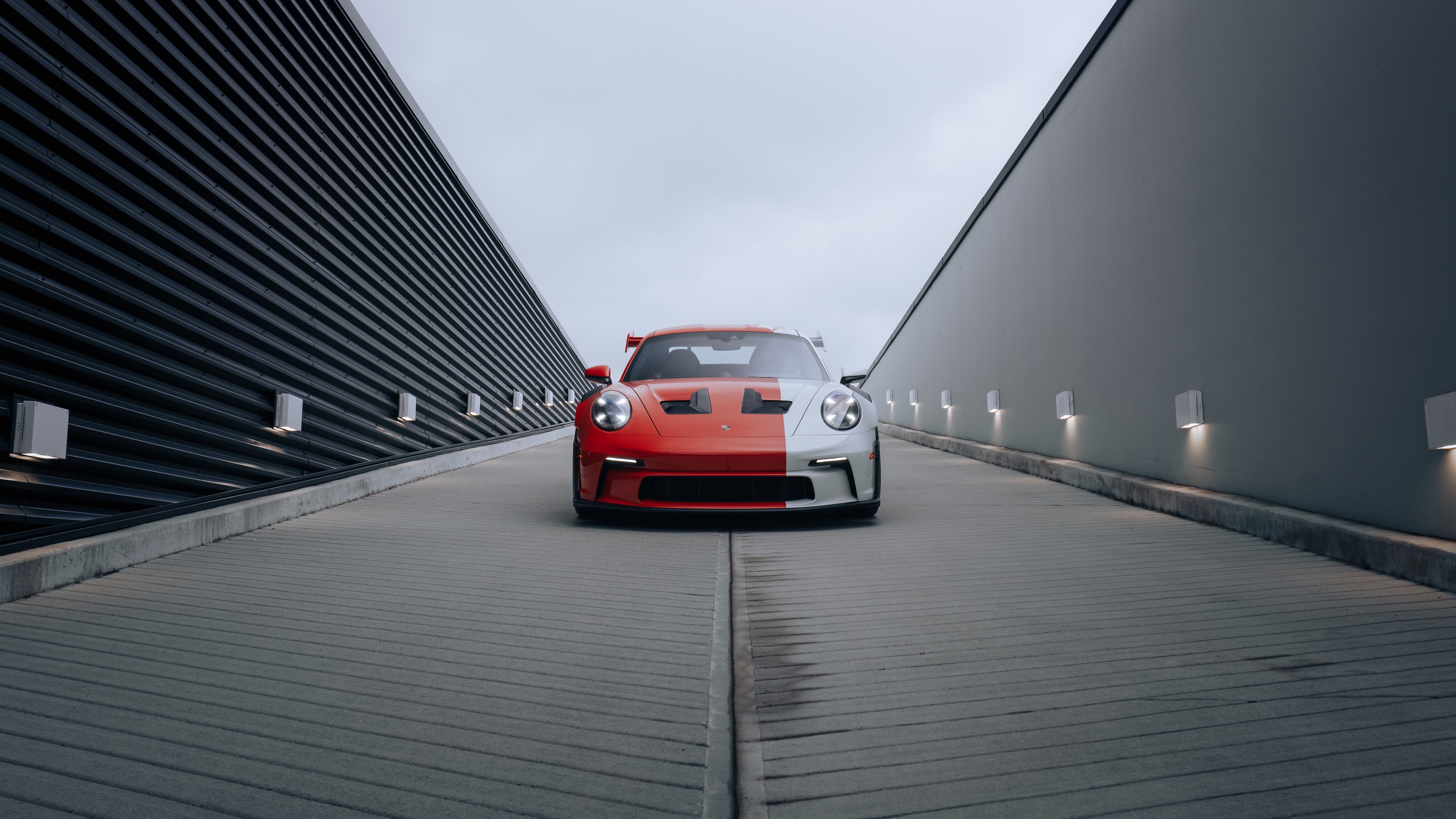A highly detailed, 8K resolution close-up of a 2024 Porsche 911 GT3 RS sports car showcasing its aerodynamic body.