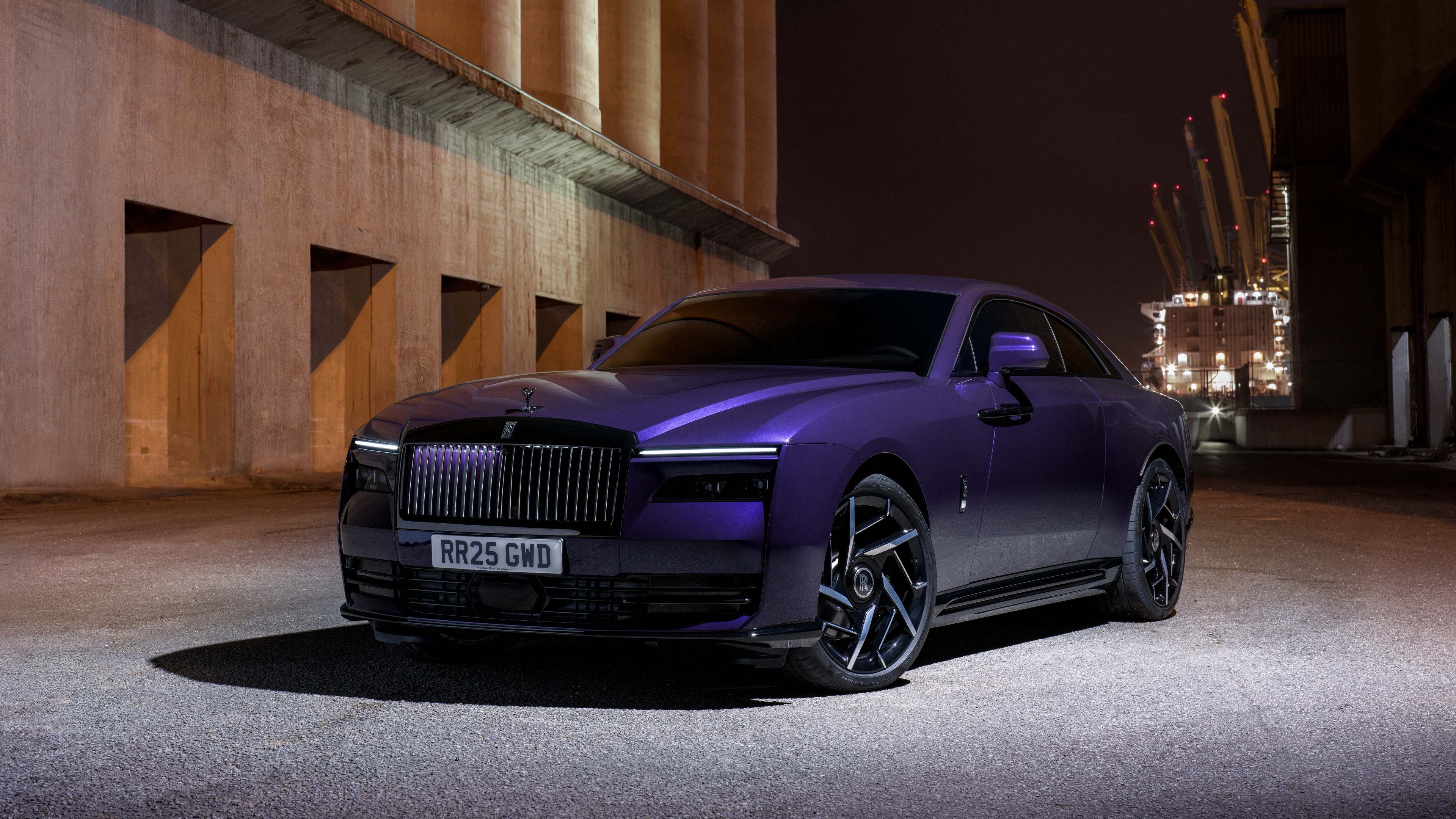 A sleek and powerful Rolls-Royce Black Badge Spectre in a high-resolution cinematic setting.