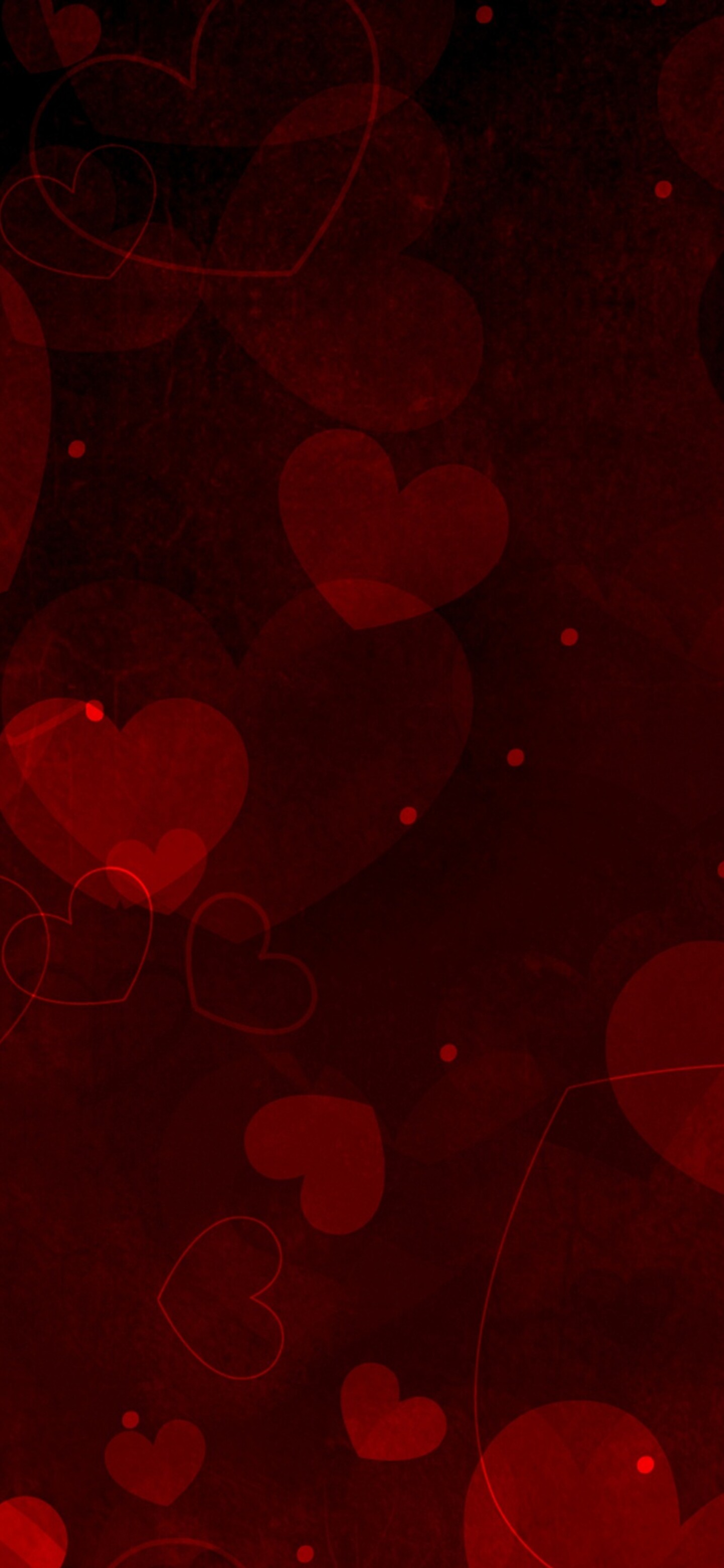 A beautiful and dense arrangement of various sized vibrant red hearts creating a romantic pattern.