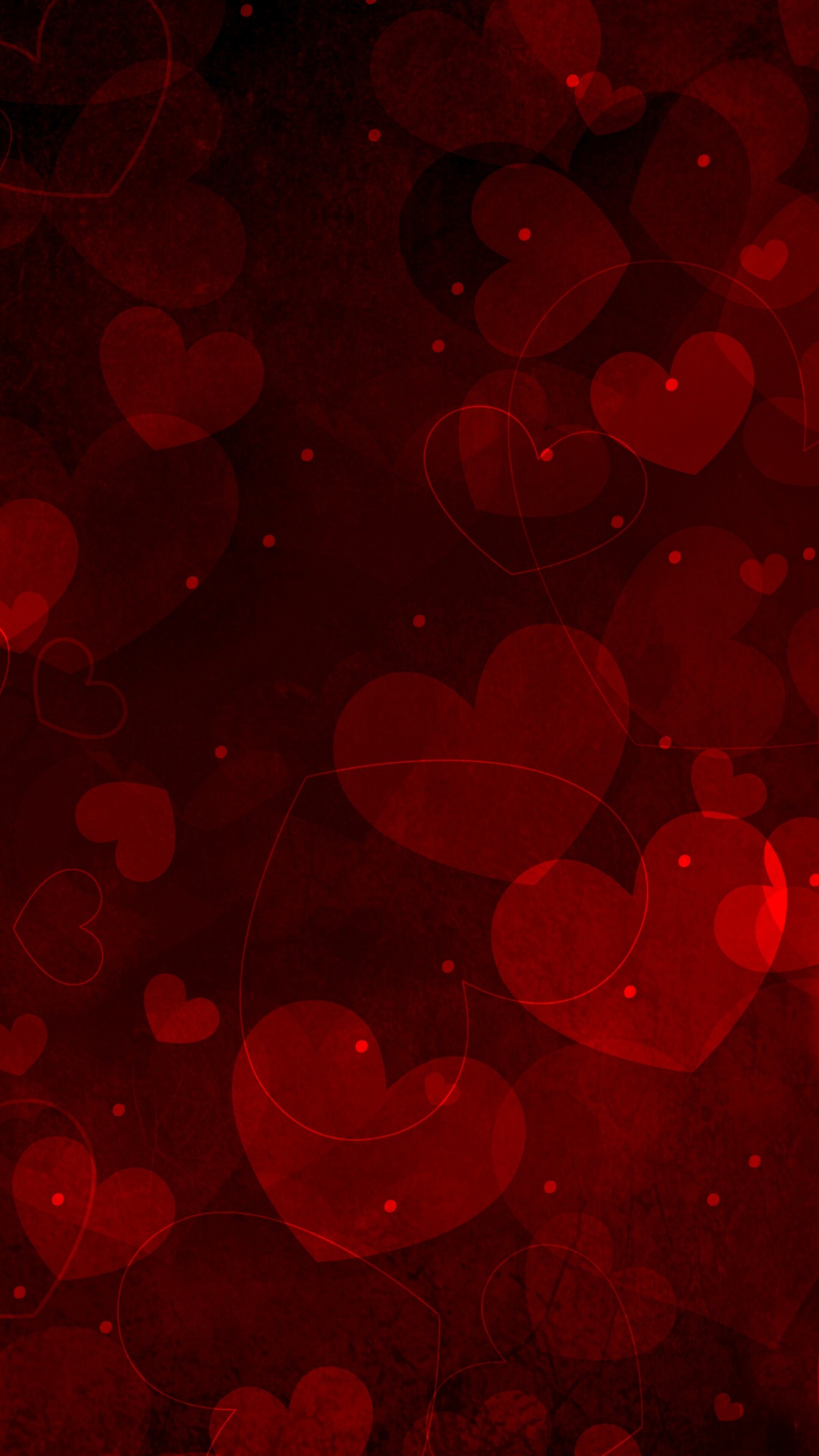 A cluster of various sized, vibrant red hearts arranged in a romantic composition.