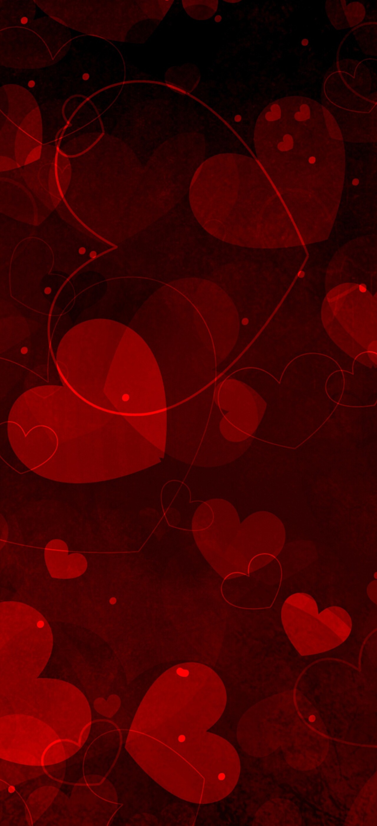 A collection of multiple vibrant red hearts scattered in a romantic arrangement.