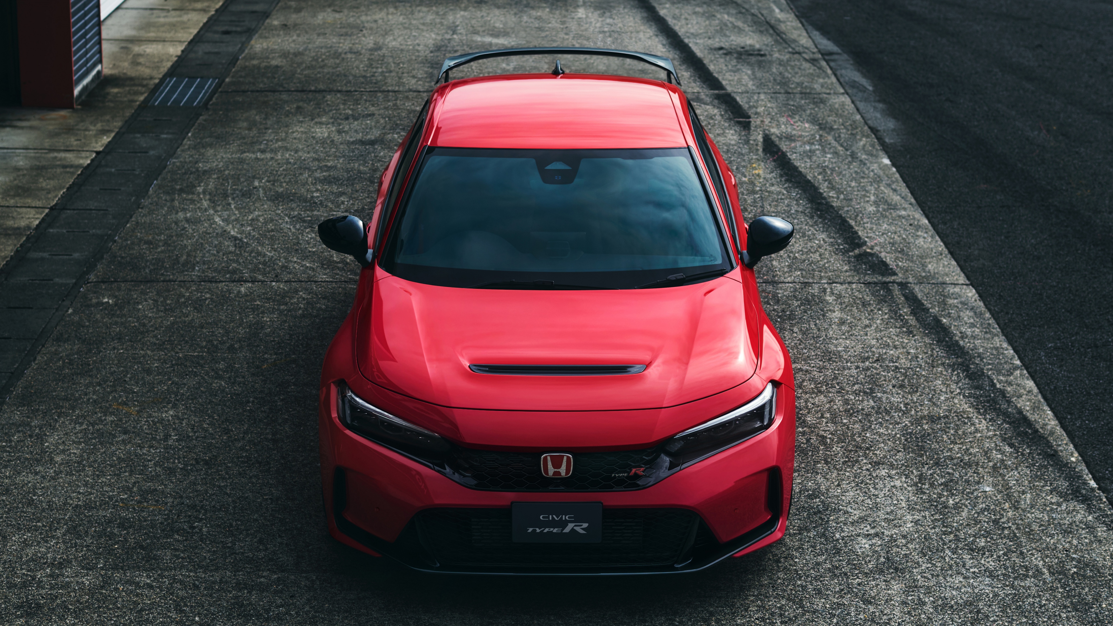 A high-resolution 5K image of a vibrant red Honda Civic Type R.