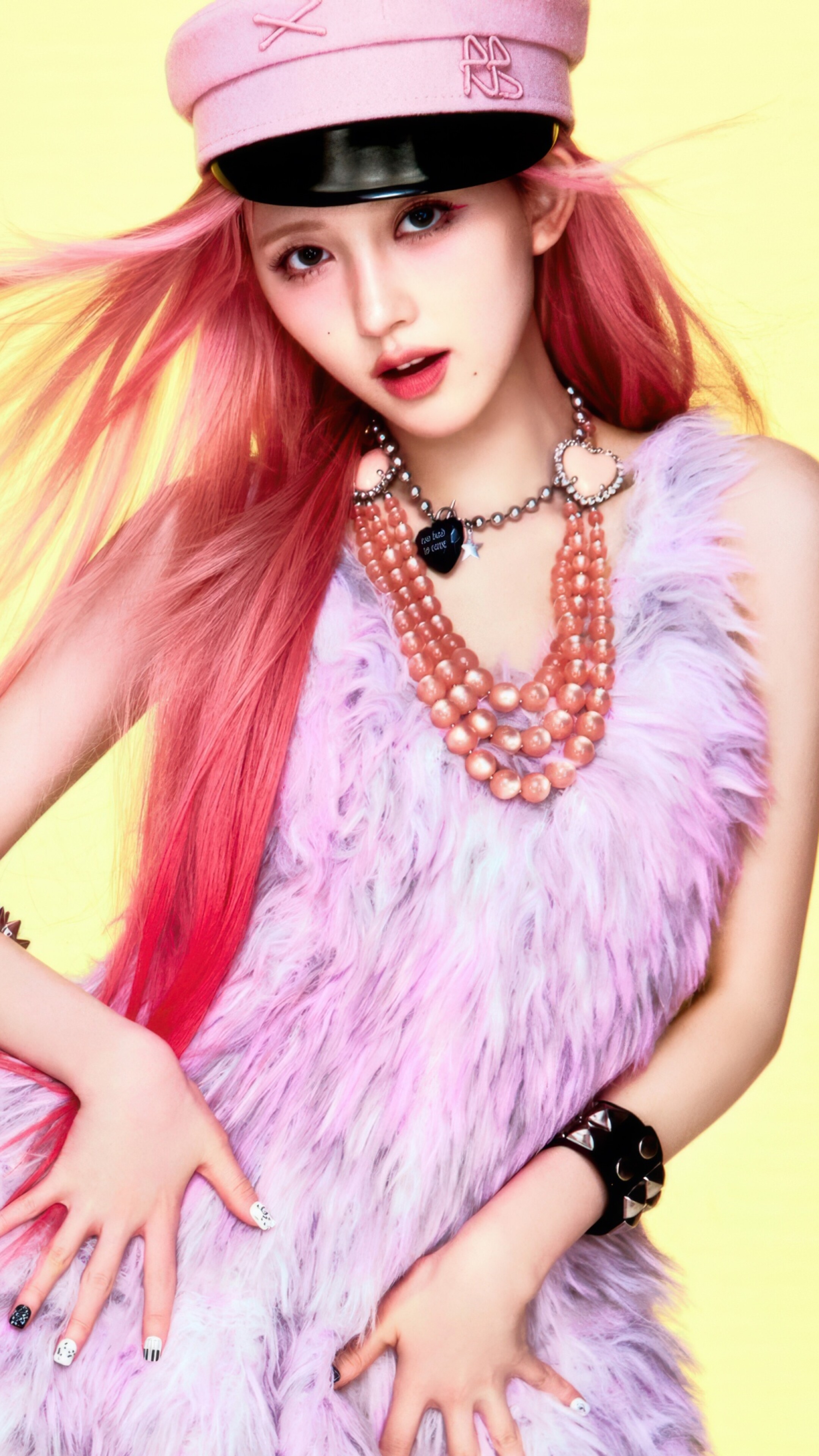 A high-definition portrait of Gaeul from the K-pop group IVE featuring a vibrant yellow backdrop.