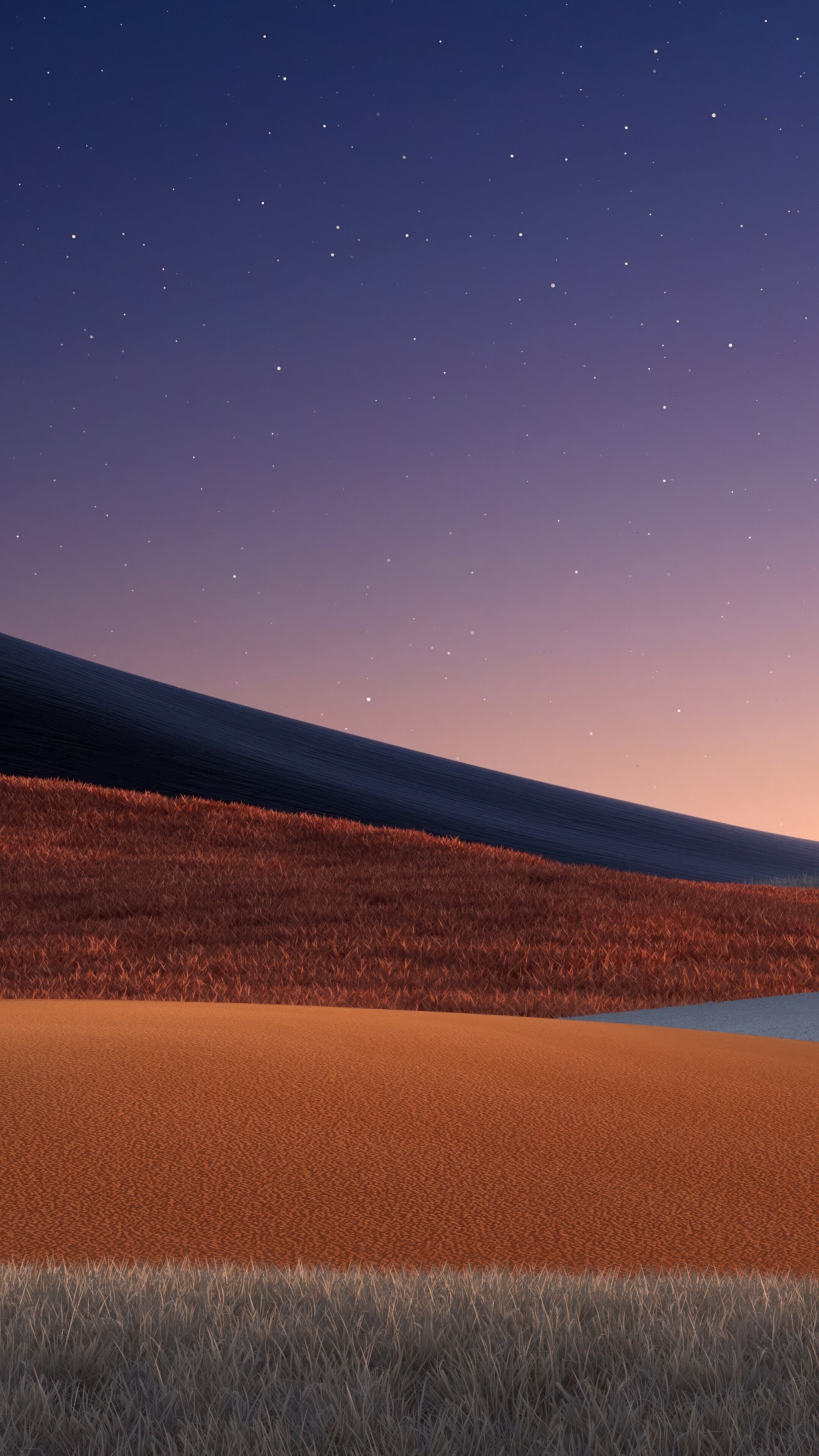 A peaceful landscape of rolling hills and a grassy field under a starry twilight sky at sunset.