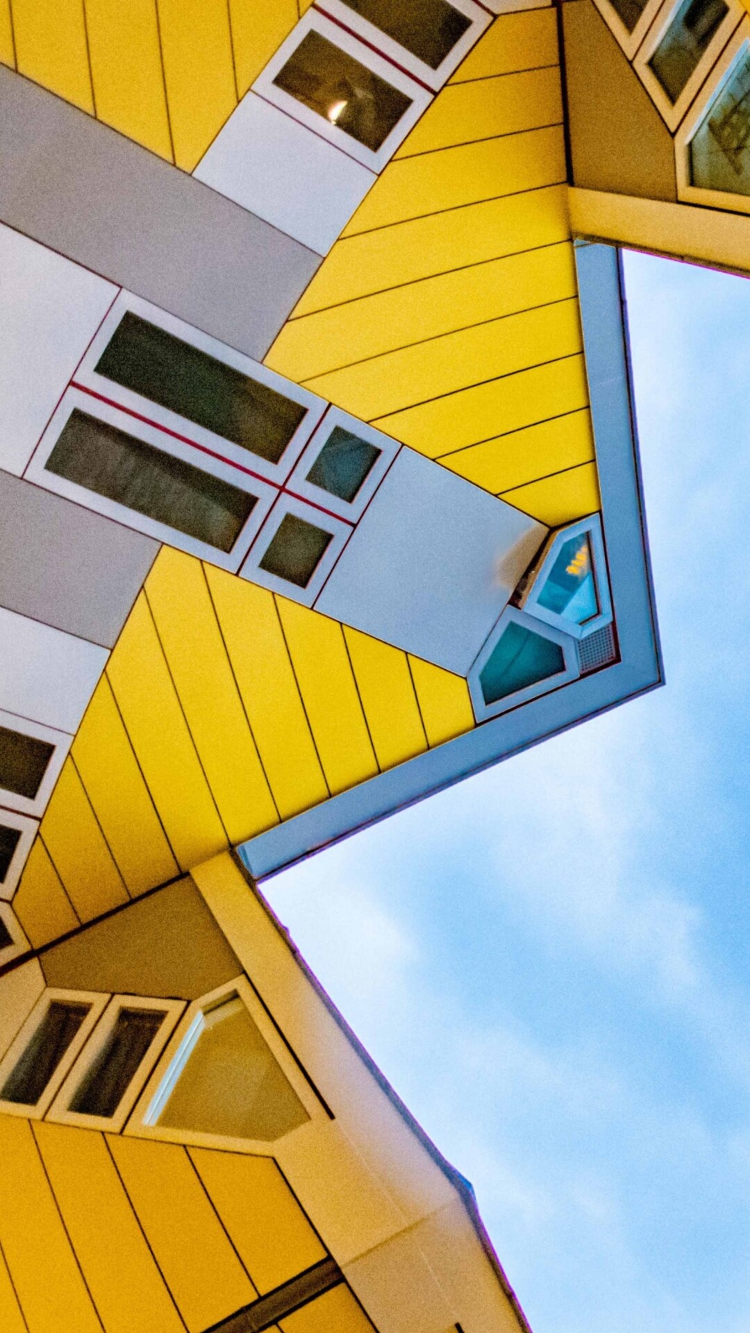 An aerial view looking down at the famous geometric Cube Houses in Rotterdam, Netherlands, showcasing modern Dutch architecture.