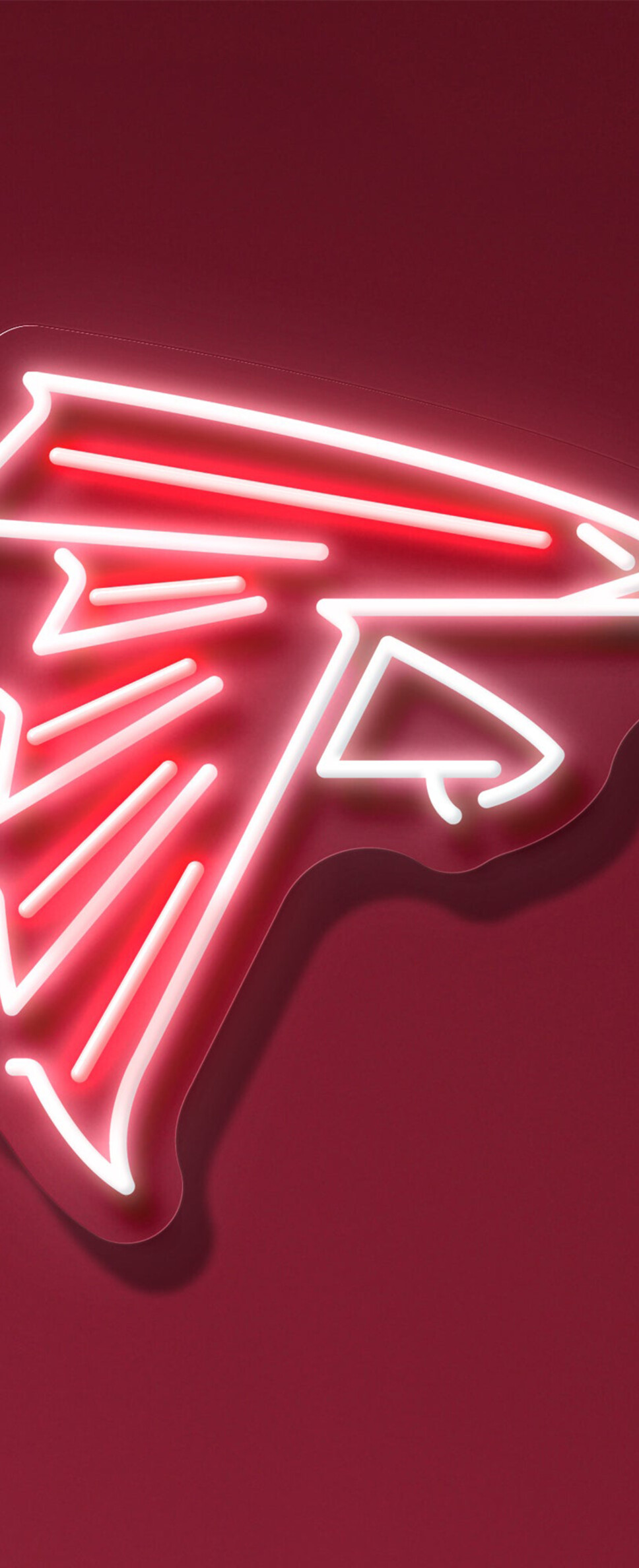 A glowing neon Atlanta Falcons logo centered on a bright red background.