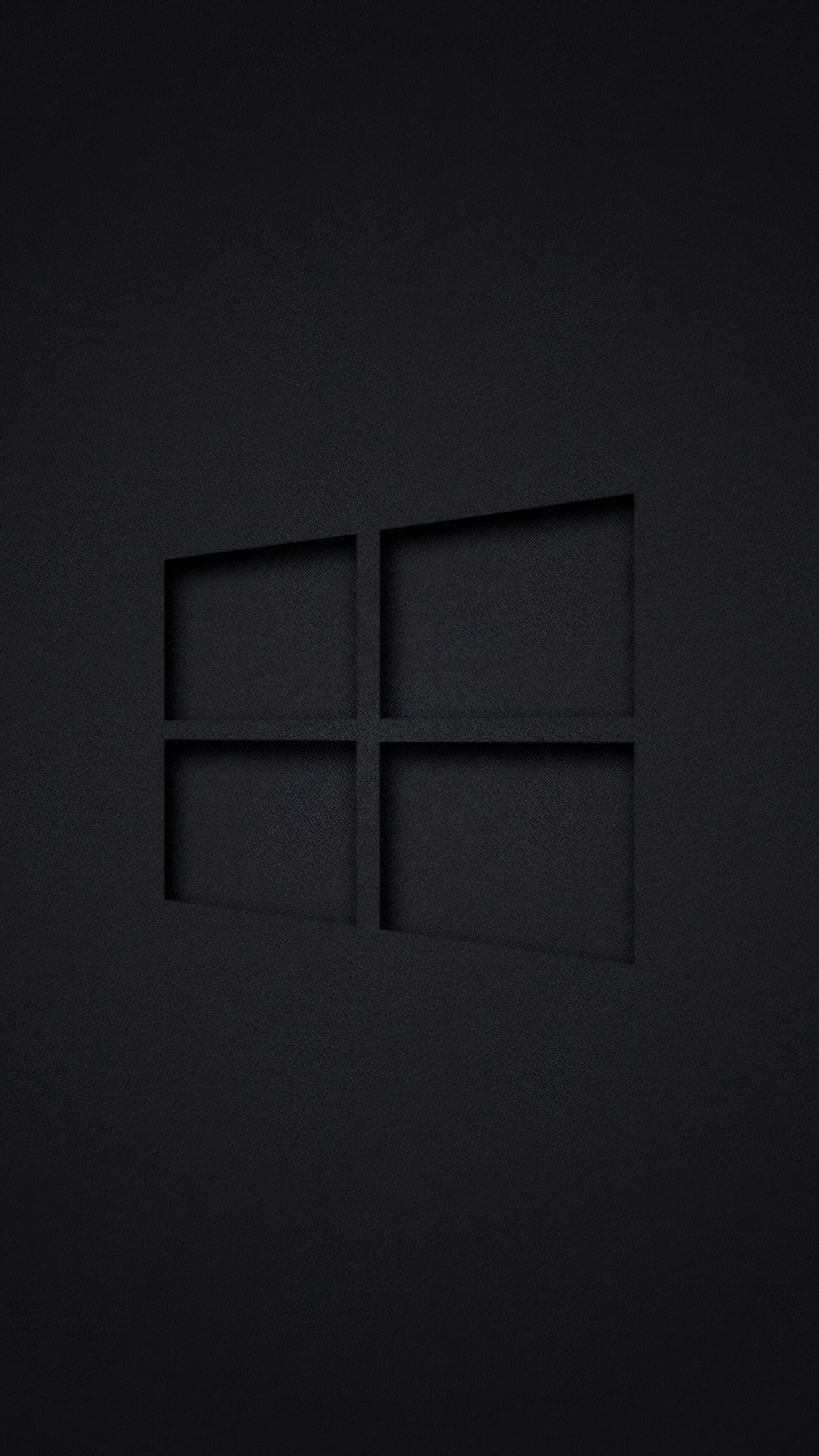 Windows 10 logo centered on a dark, minimalist background.
