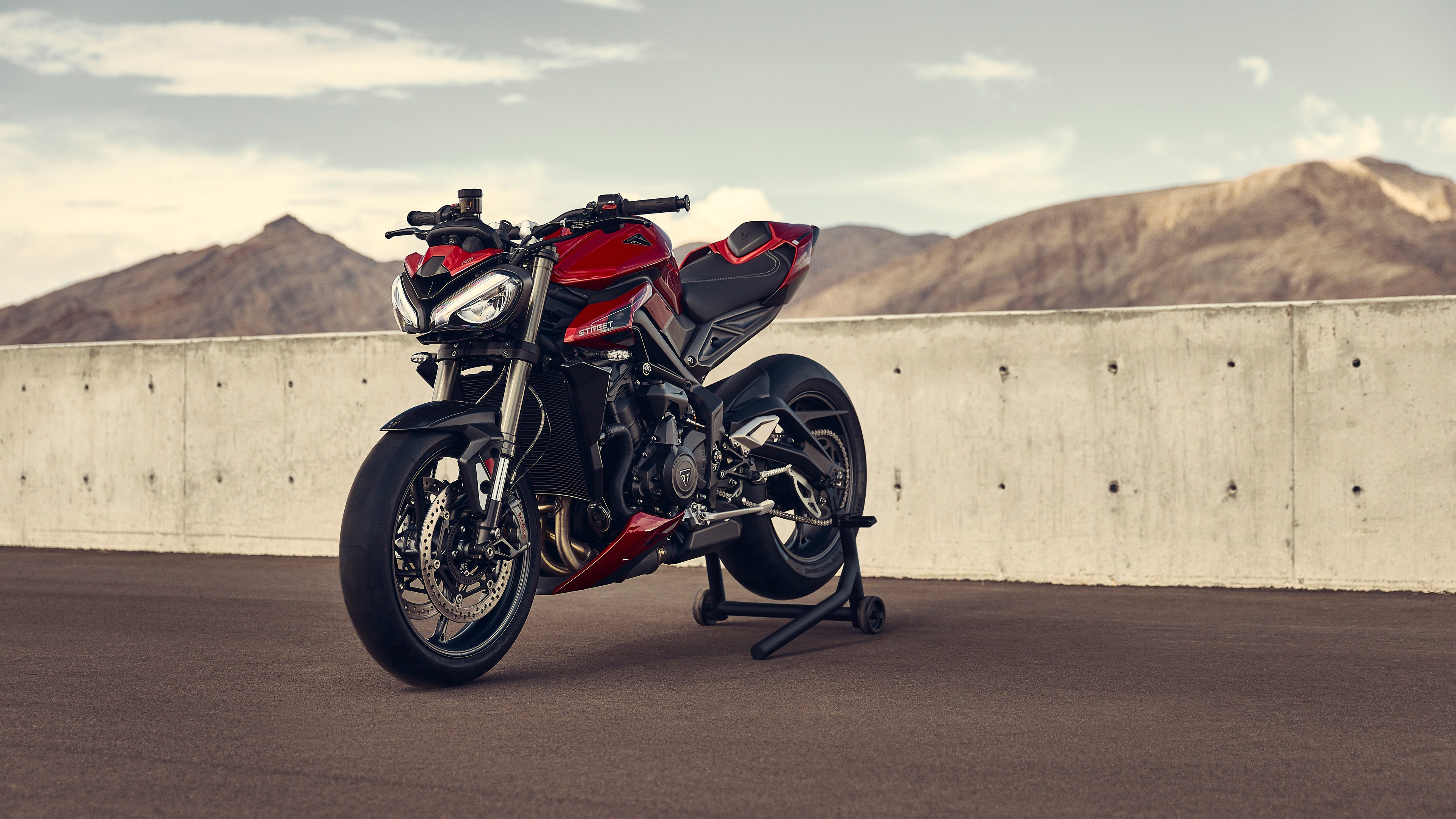 A close-up shot of a 2023 Triumph Street Triple RS motorcycle featuring its distinctive naked bike styling.