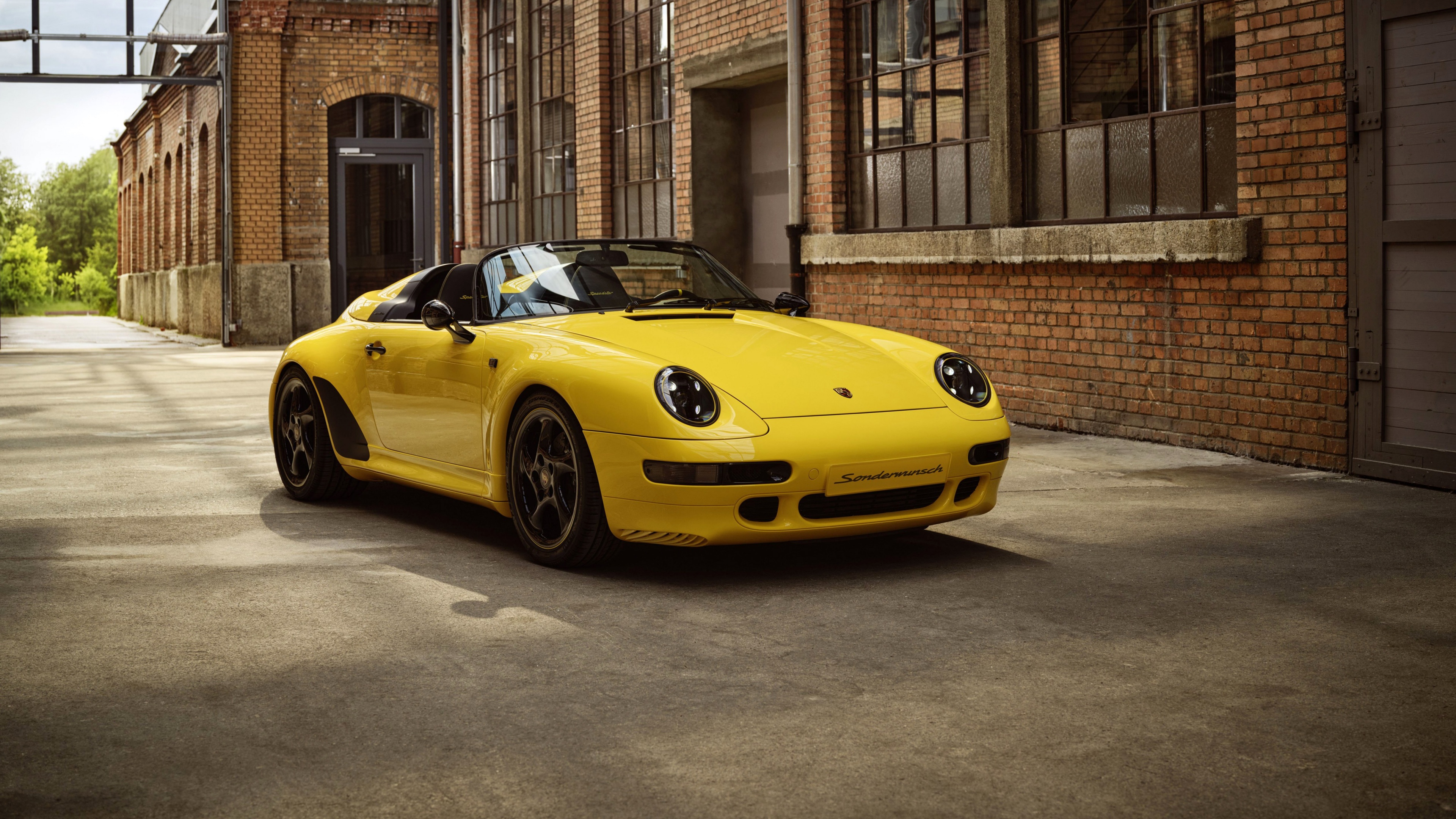 A high-detail 5K shot of a 2024 Porsche 911 Speedster featuring its sleek, aerodynamic design and classic sports car profile.