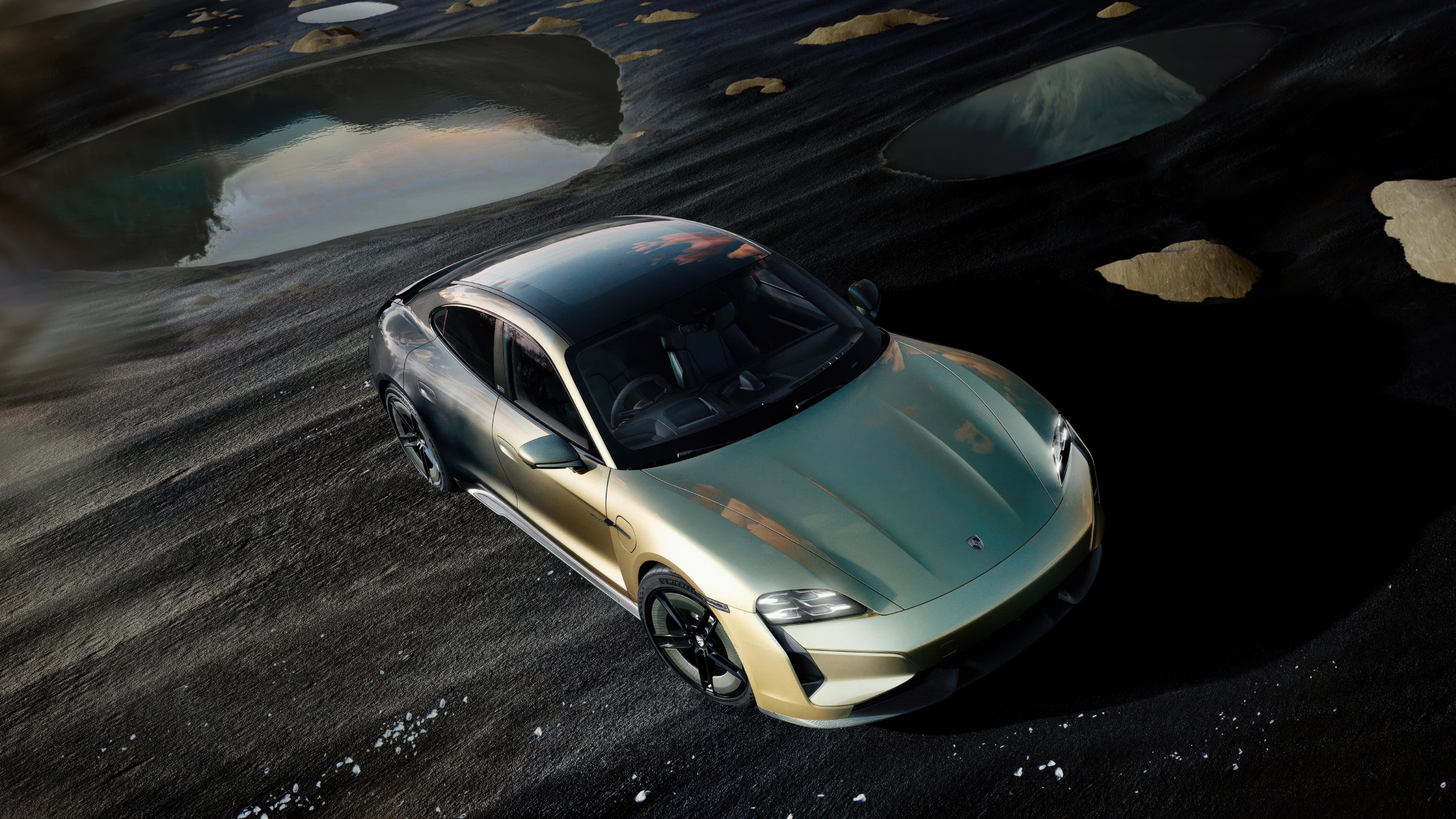 Close-up shot of a 2024 Porsche Taycan Turbo S electric luxury sports car.