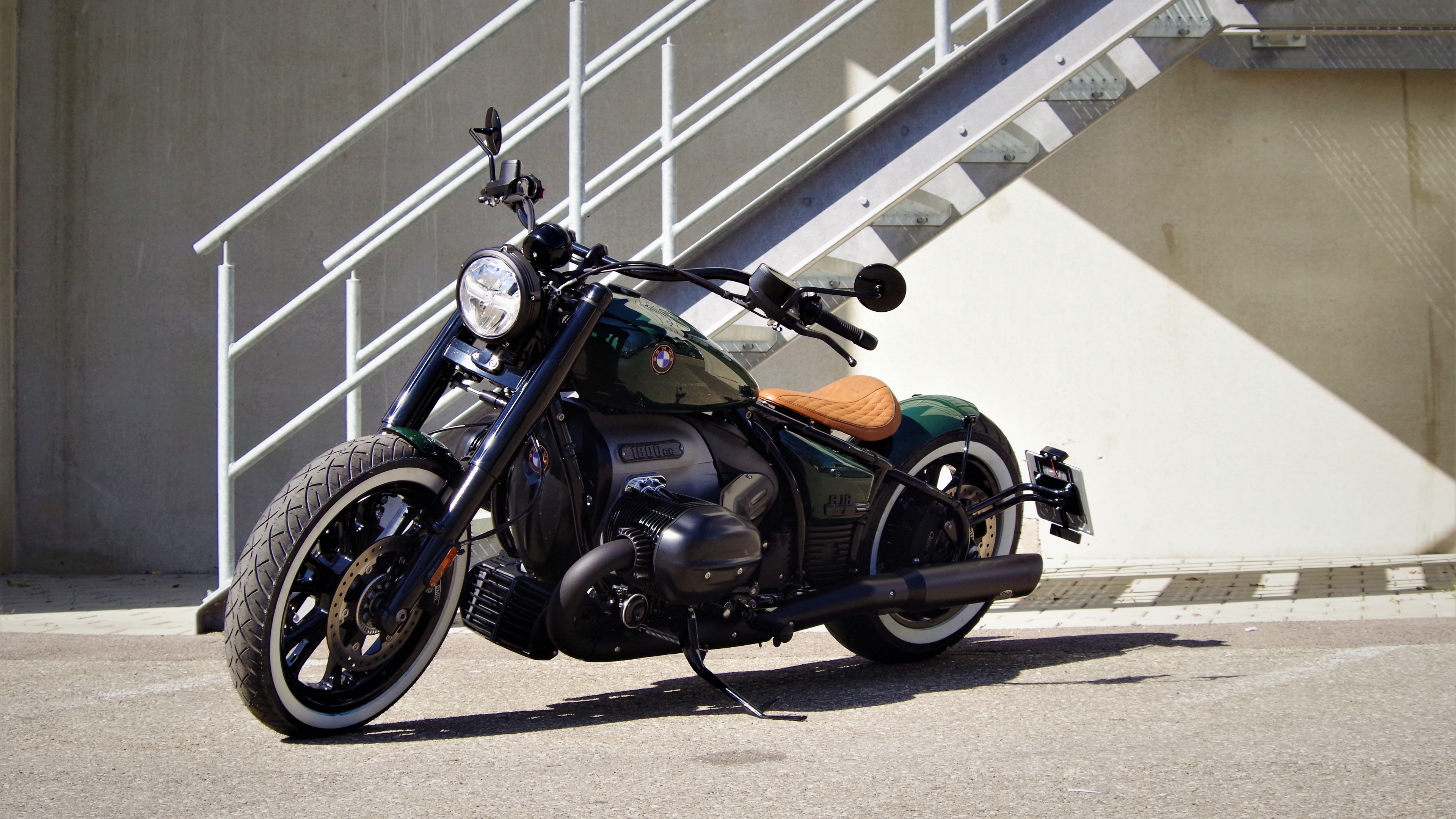A high-resolution 5K close-up of a customized BMW R 18 cruiser motorcycle.