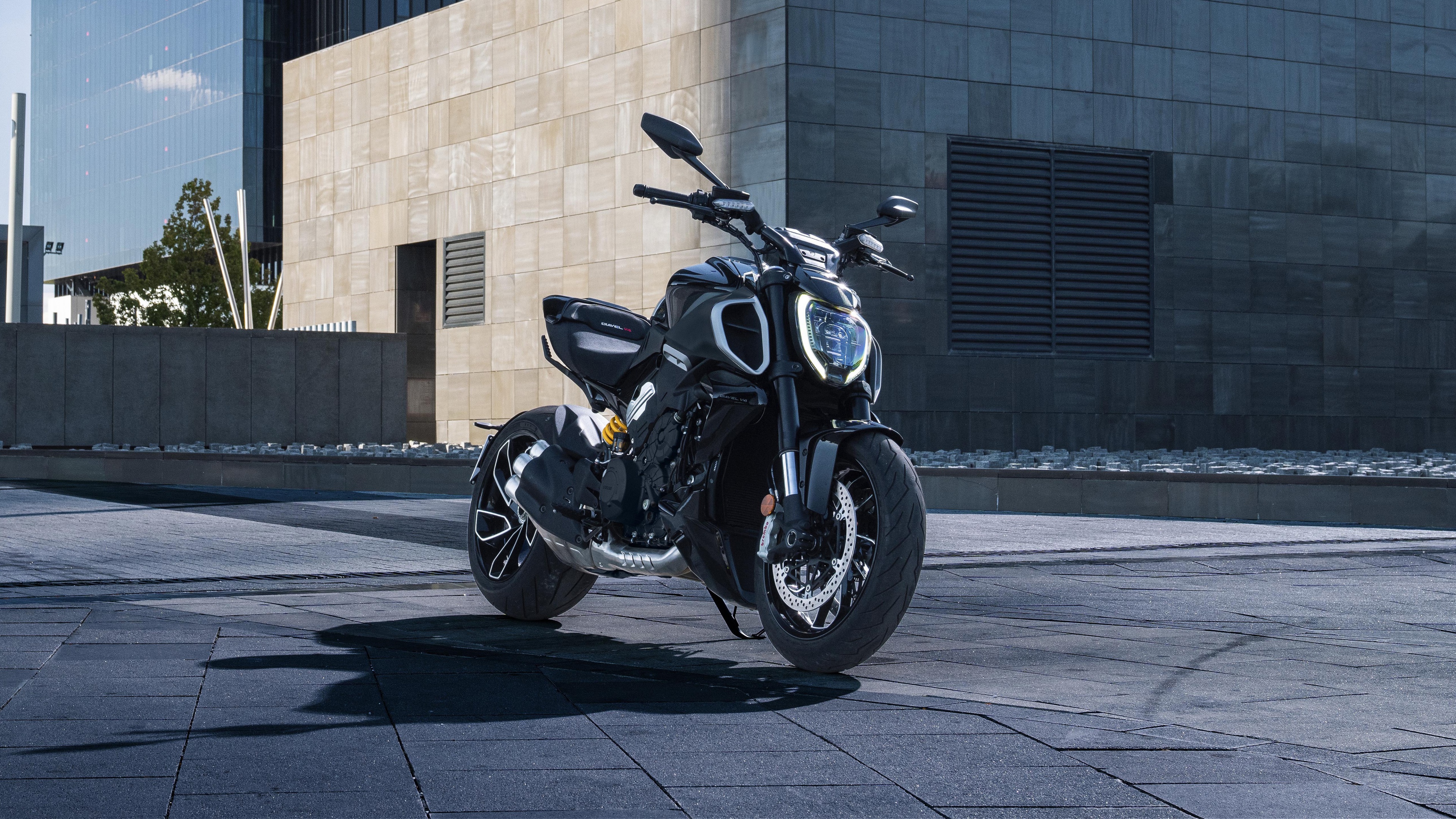 A high-detail shot of a 2023 Ducati Diavel V4 muscle cruiser motorcycle featuring aggressive design and premium finishes.