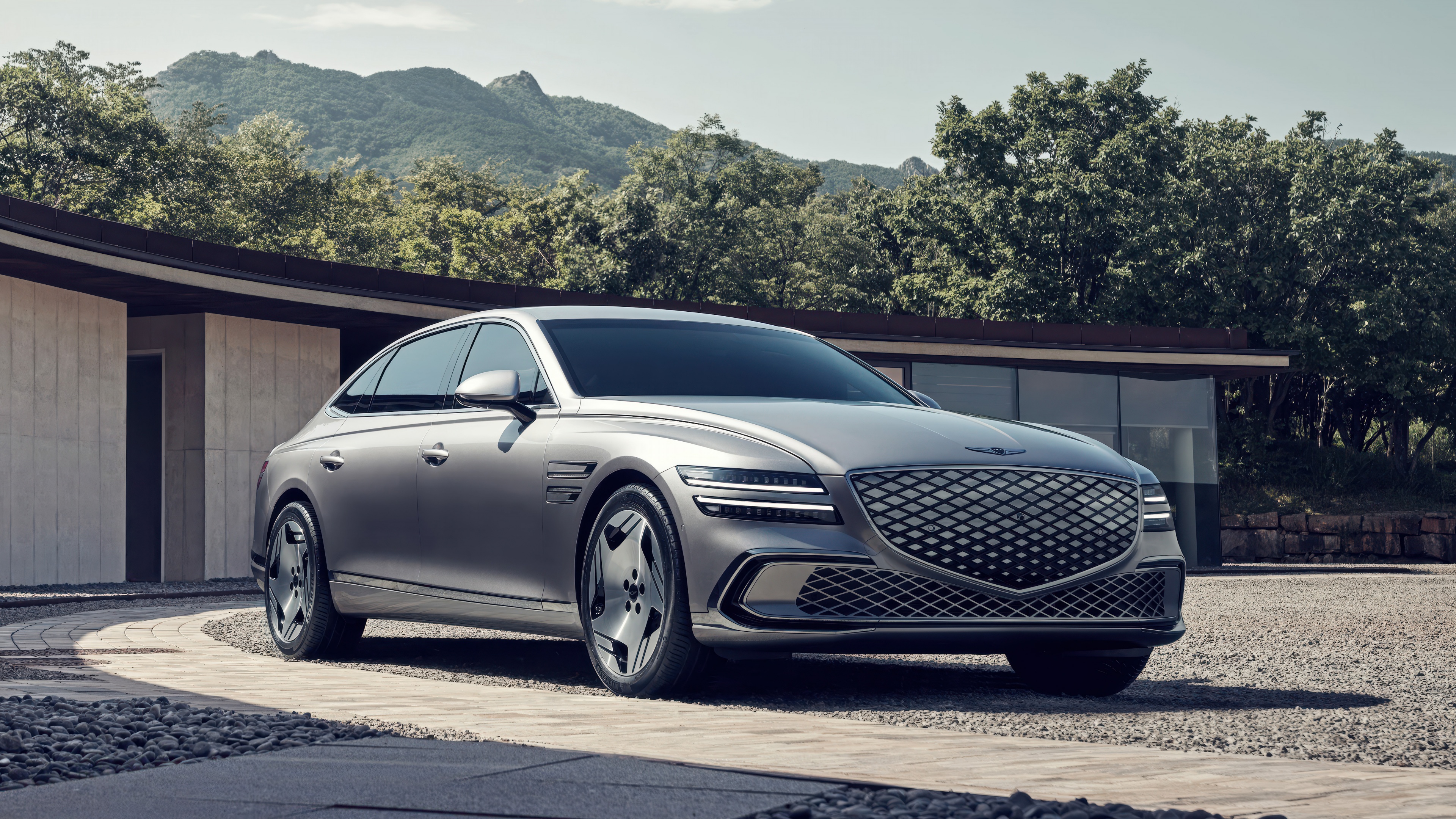 A sleek and sophisticated Genesis Electrified G80 electric luxury sedan in a high-resolution cinematic setting.