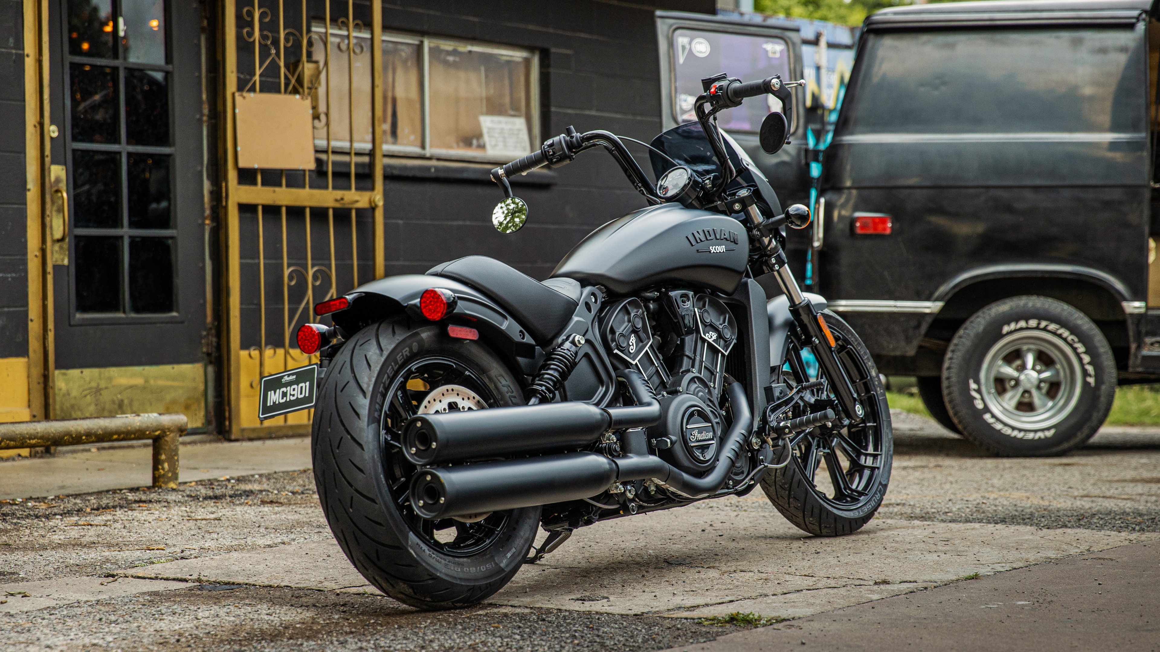 A highly detailed 5K view of a 2022 Indian Scout Rogue cruiser motorcycle with a matte black finish.