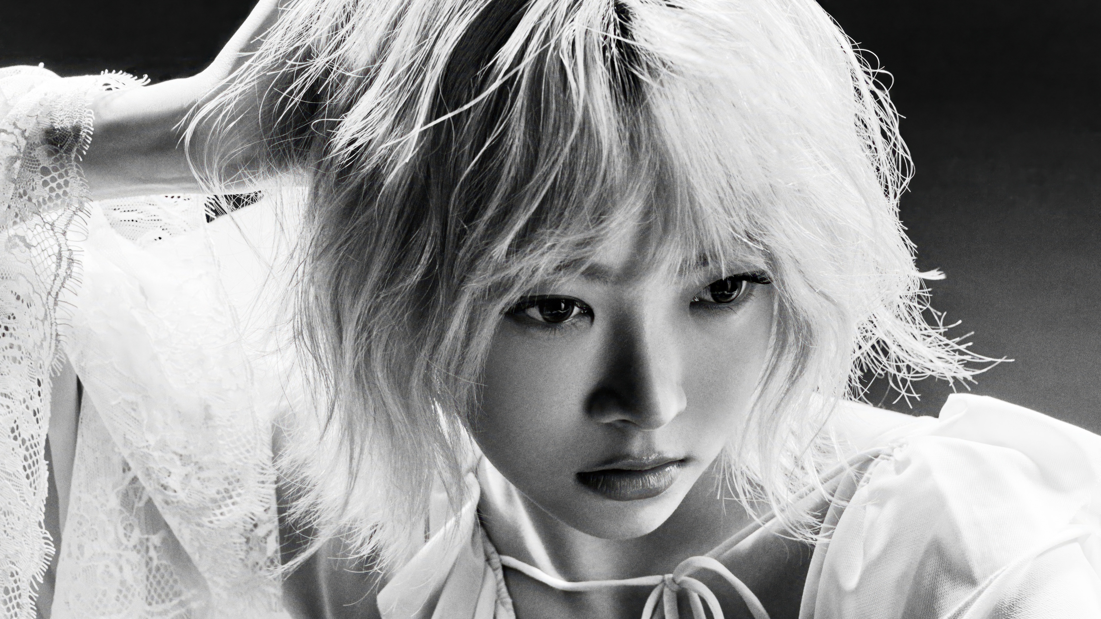 A high-quality black and white monochrome portrait of the South Korean K-pop group Le Sserafim.