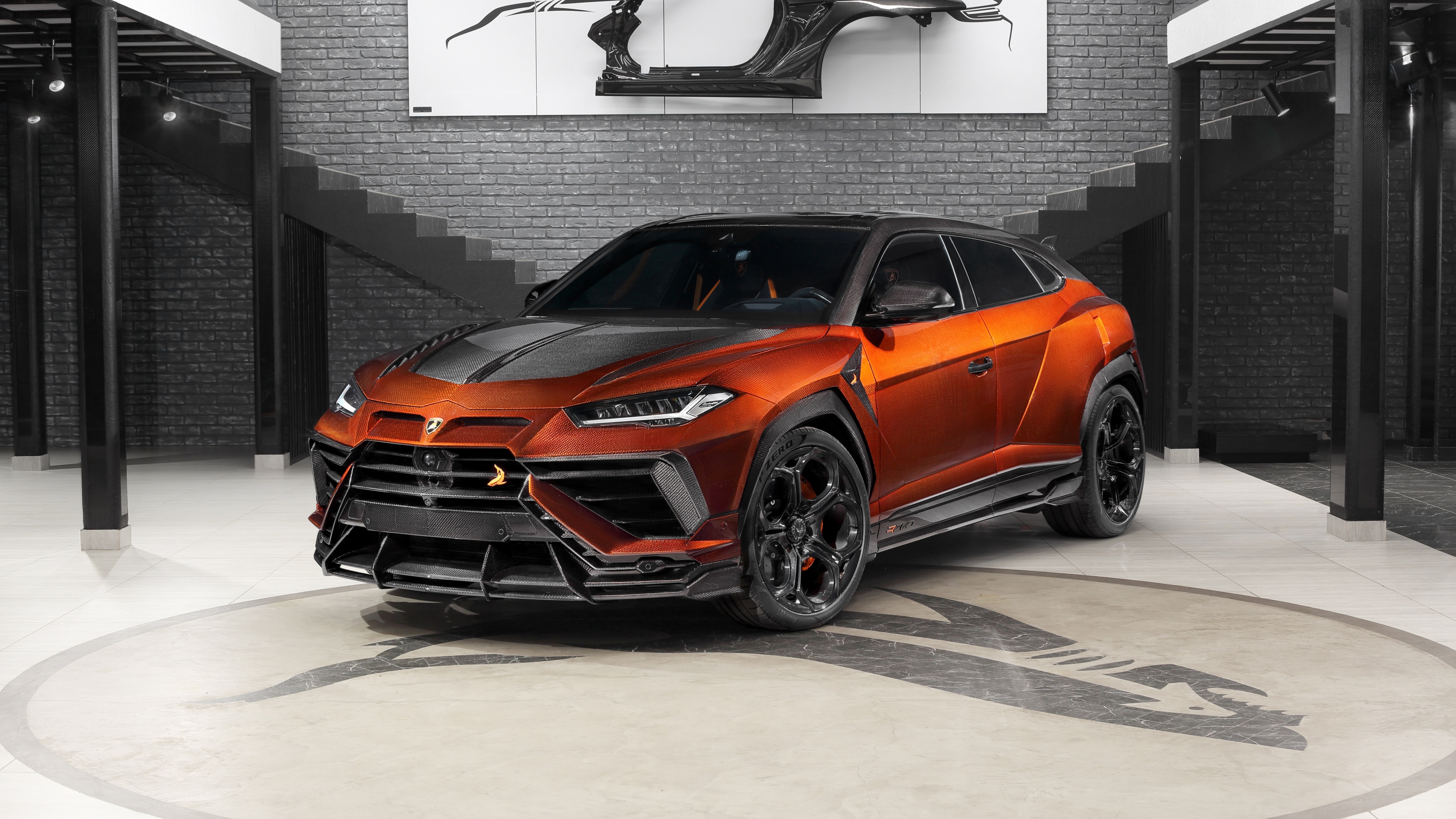 A matte black Lamborghini Urus R'Evo Stealth Edition featuring a custom widebody kit by TopCar Design.