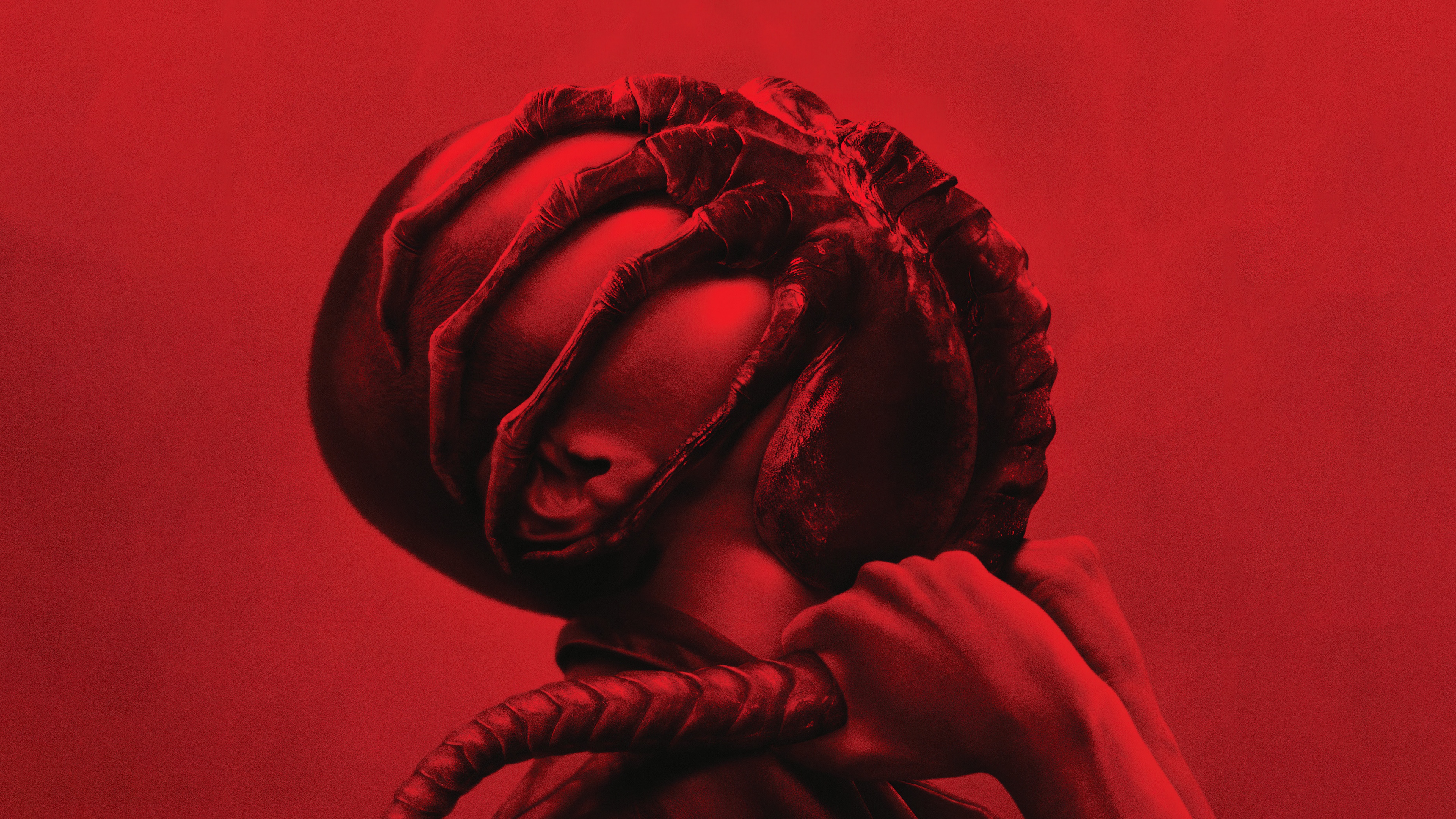 A cinematic poster of the Xenomorph from the movie Alien: Romulus set against a dramatic red background.