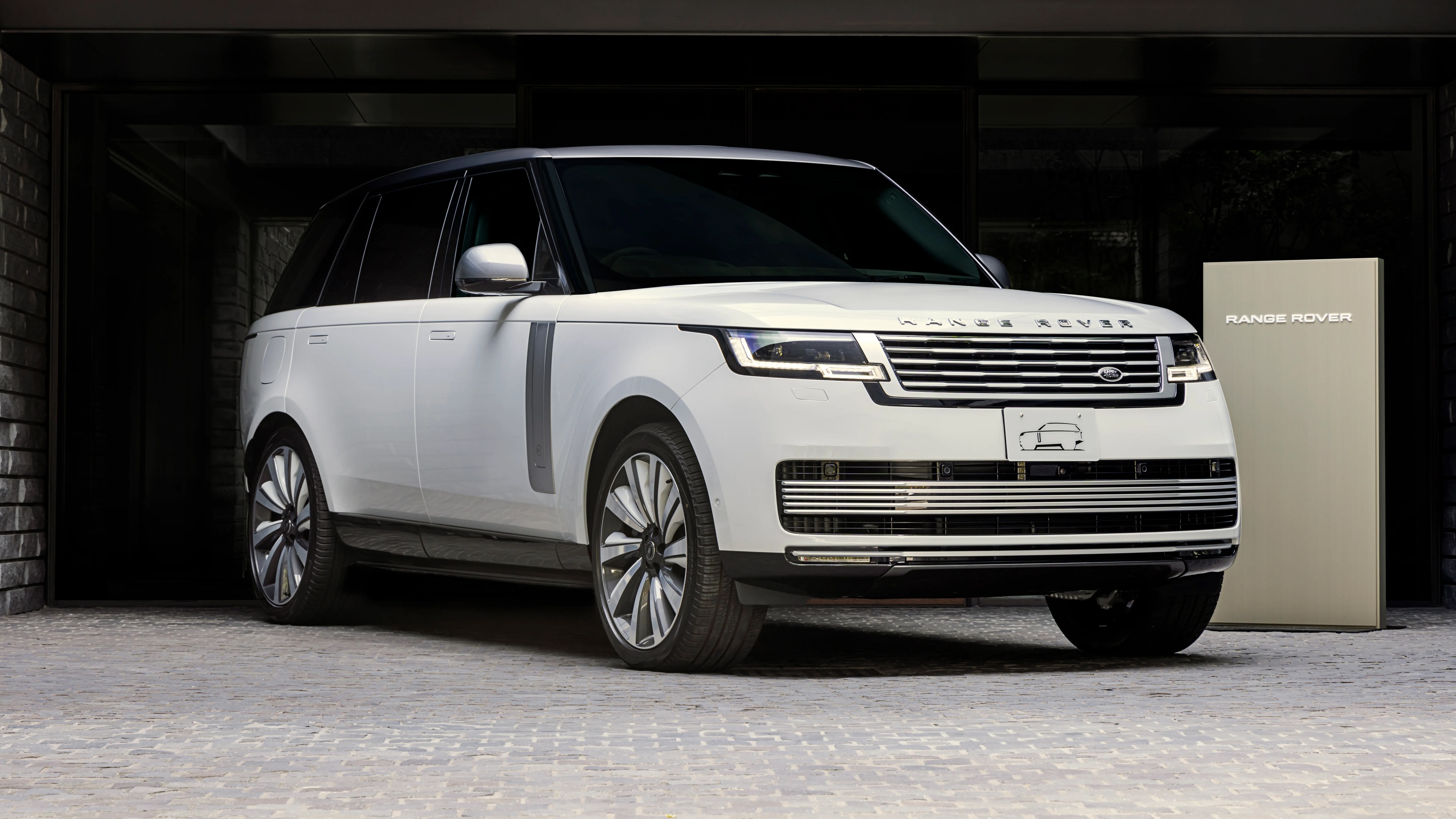 A close-up, high-resolution view of a customized 2024 Range Rover SV luxury SUV.