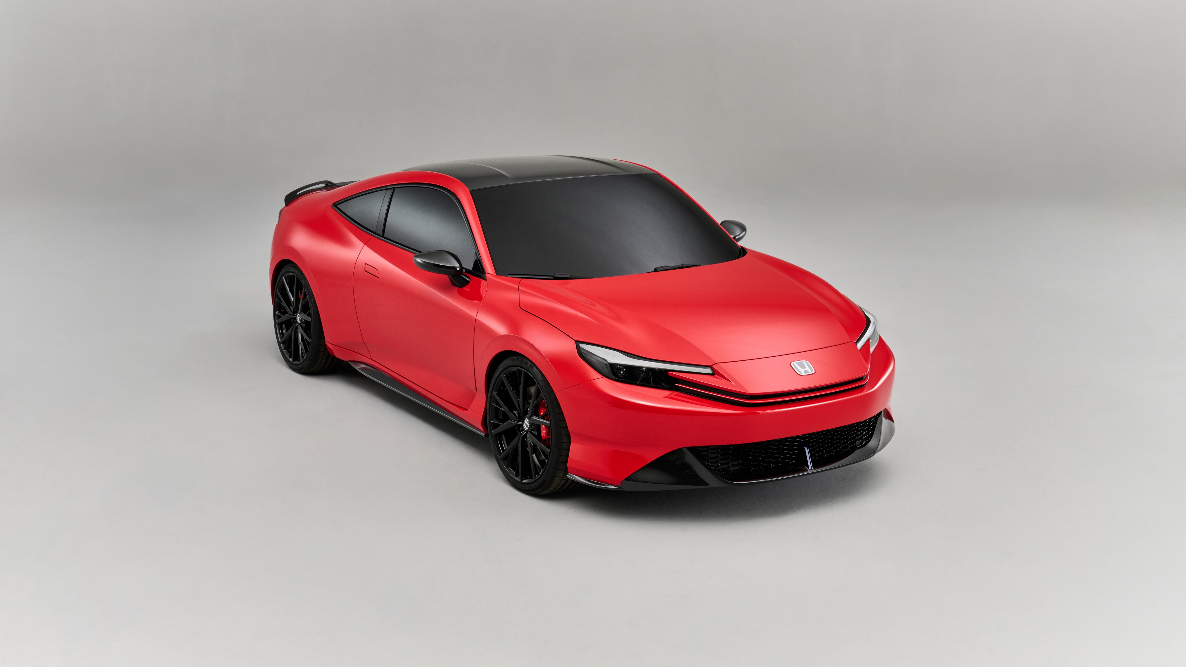 A sleek and futuristic 2024 Honda Prelude concept car featuring modern aerodynamic styling and a low-profile design.