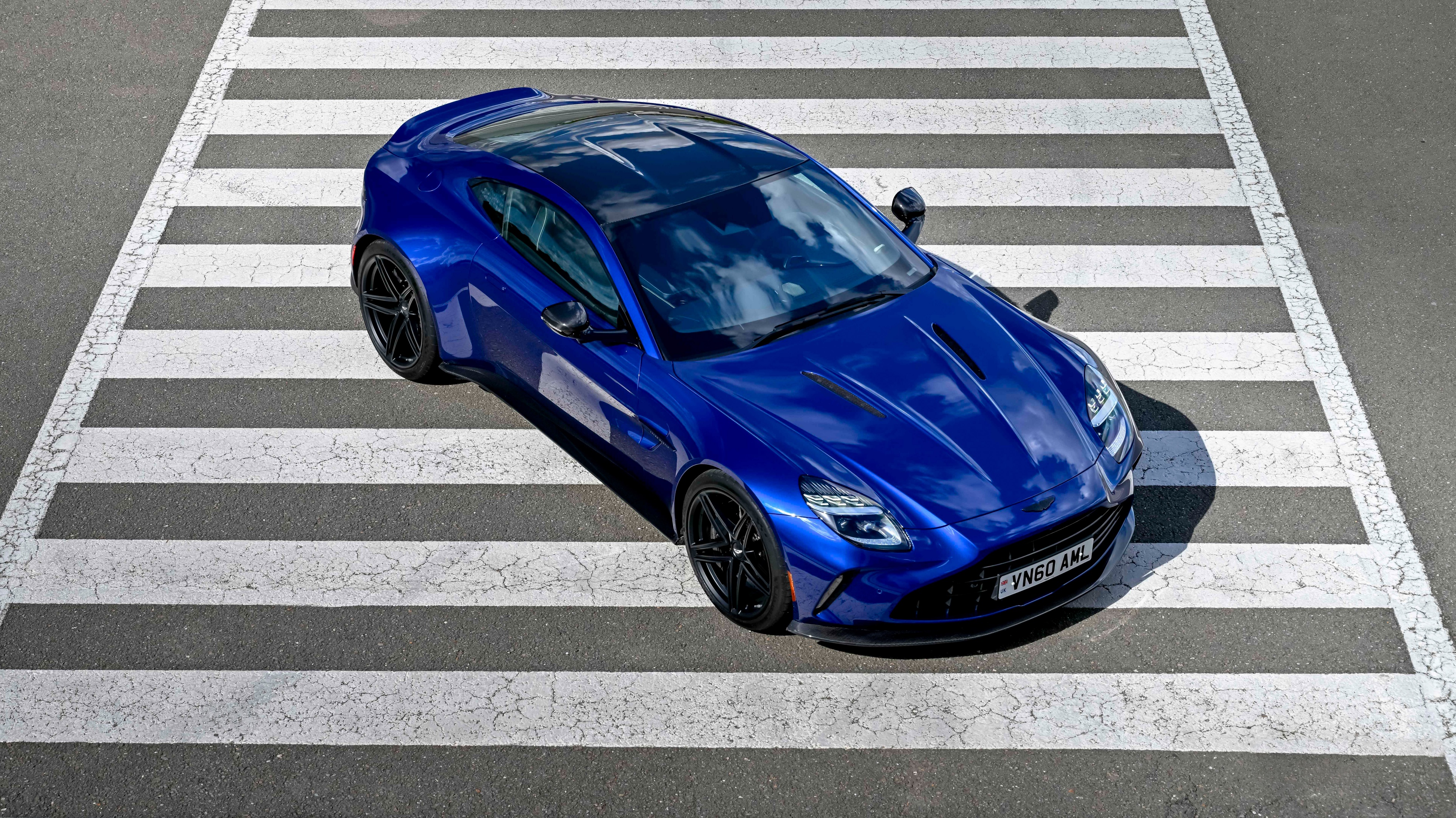 A high-resolution, cinematic view of a sleek 2025 Aston Martin Vantage luxury sports car.
