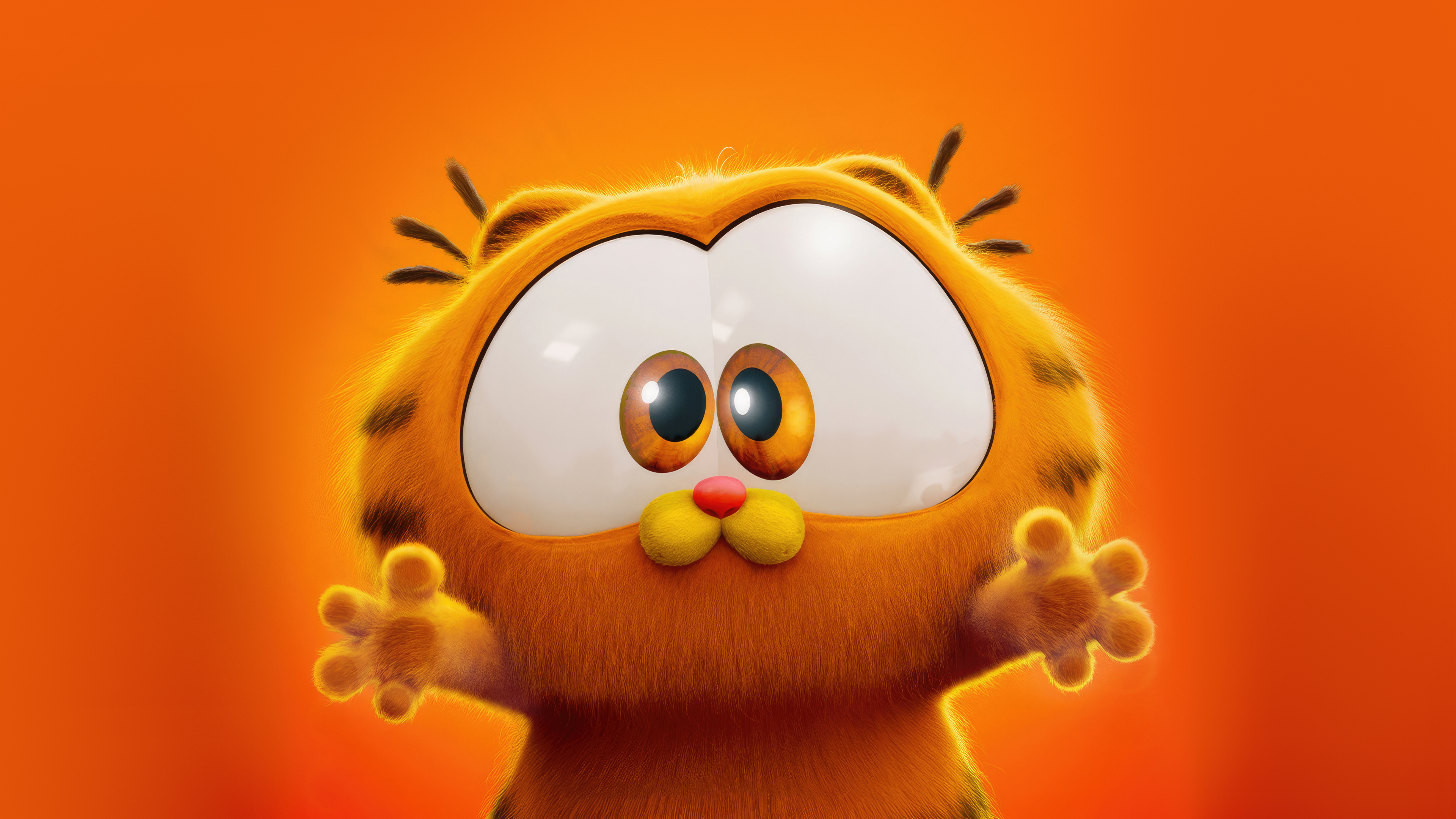 A close-up, adorable portrait of Baby Garfield from The Garfield Movie against a monochromatic orange background.