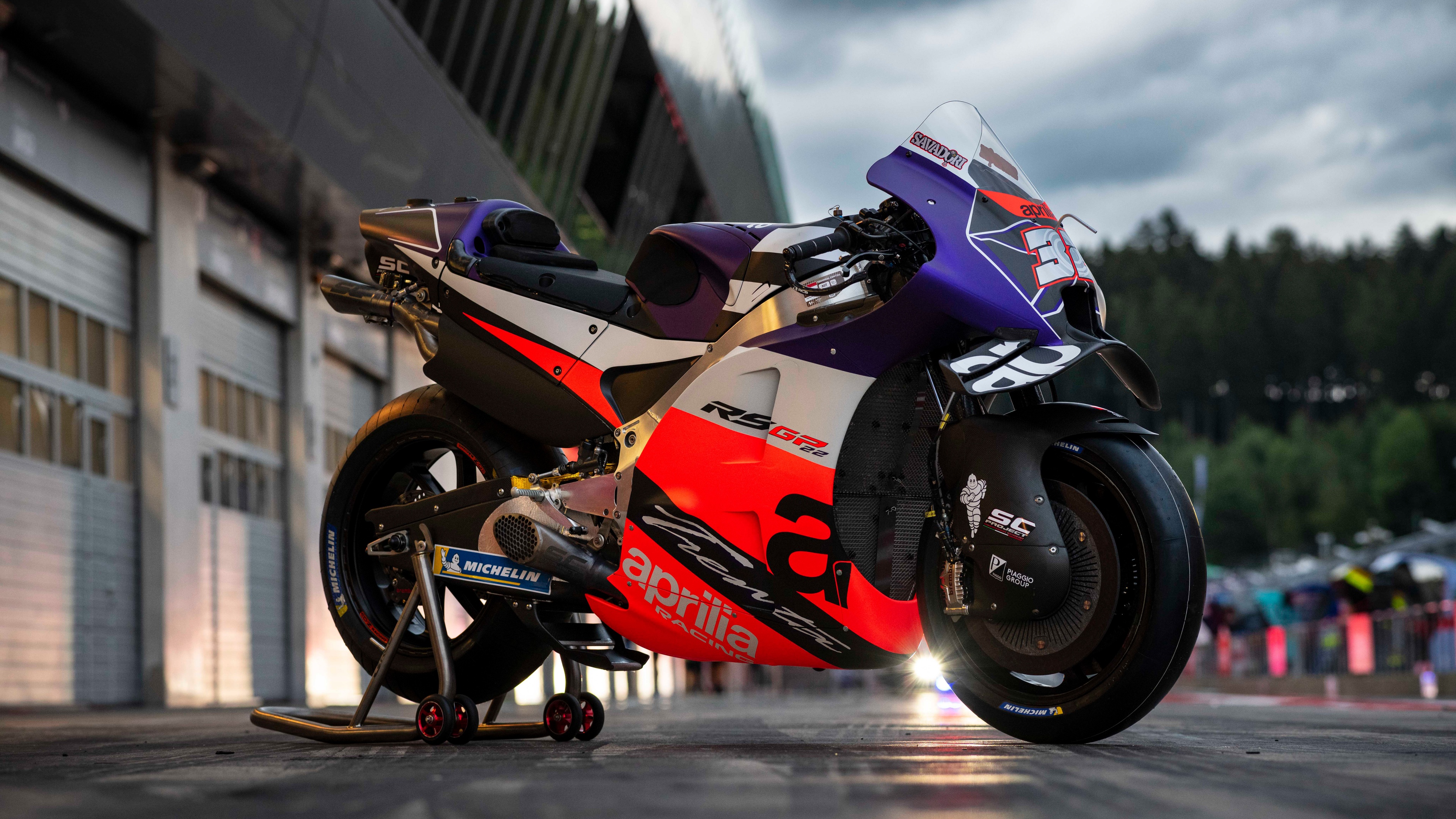 A high-detail close-up of the Aprilia RS-GP MotoGP racing bike on a professional track.