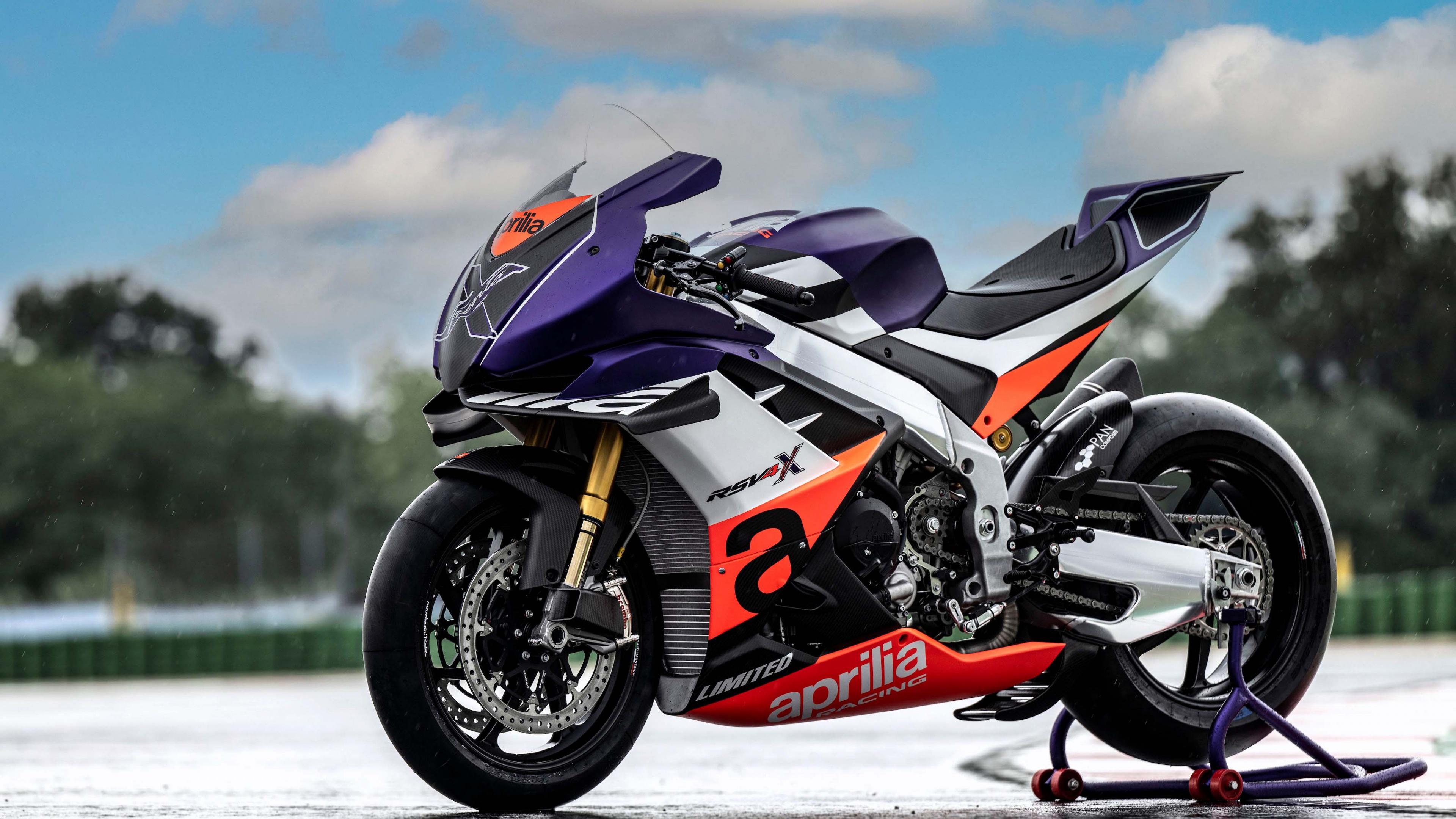 A close-up view of the Aprilia RSV4 XTrenta 2023 sports motorcycle, highlighting its sleek aerodynamic bodywork and racing-inspired design.