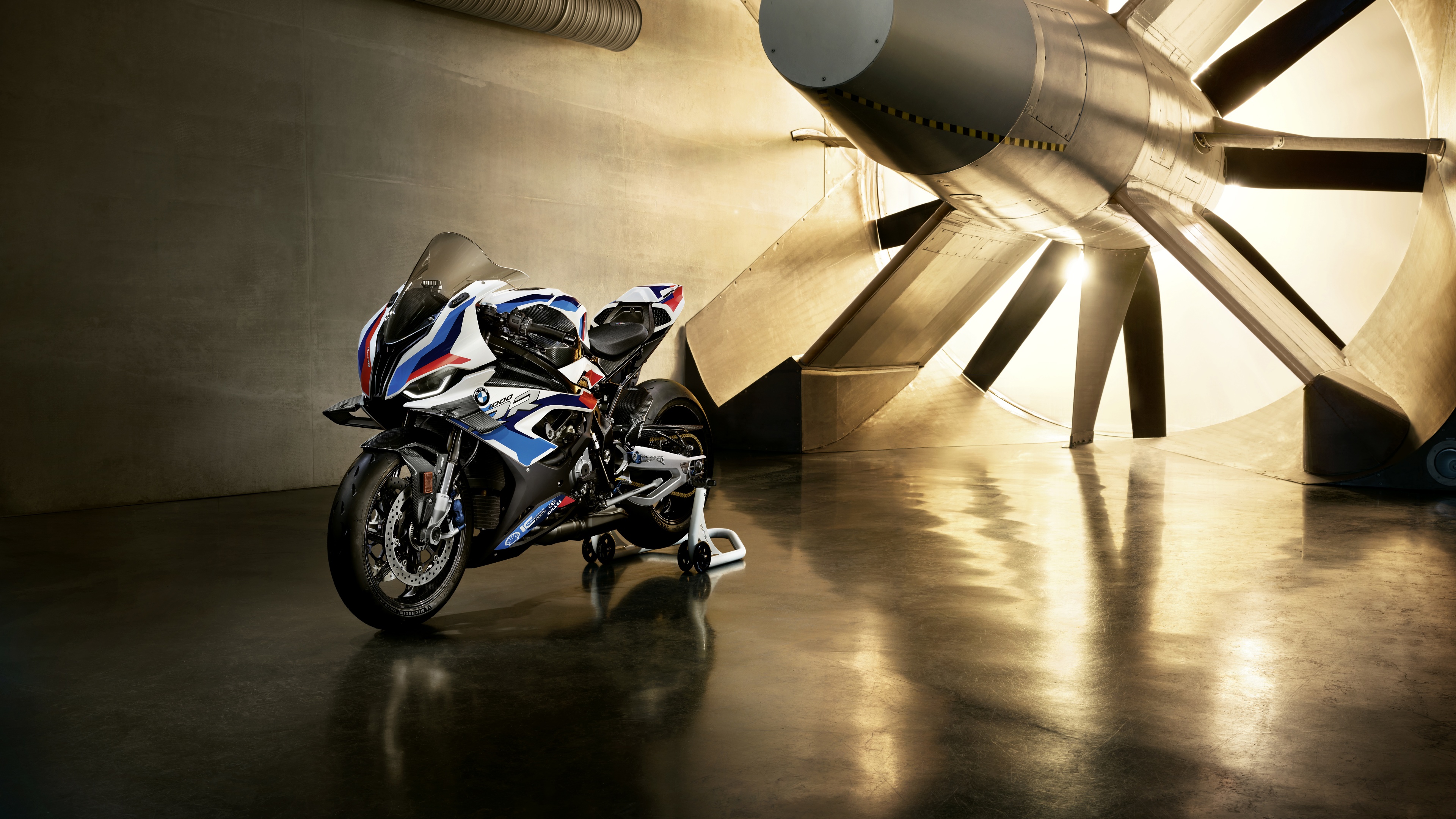 A sharp, detailed close-up of a BMW M 1000 RR sports motorcycle featuring advanced aerodynamic bodywork.