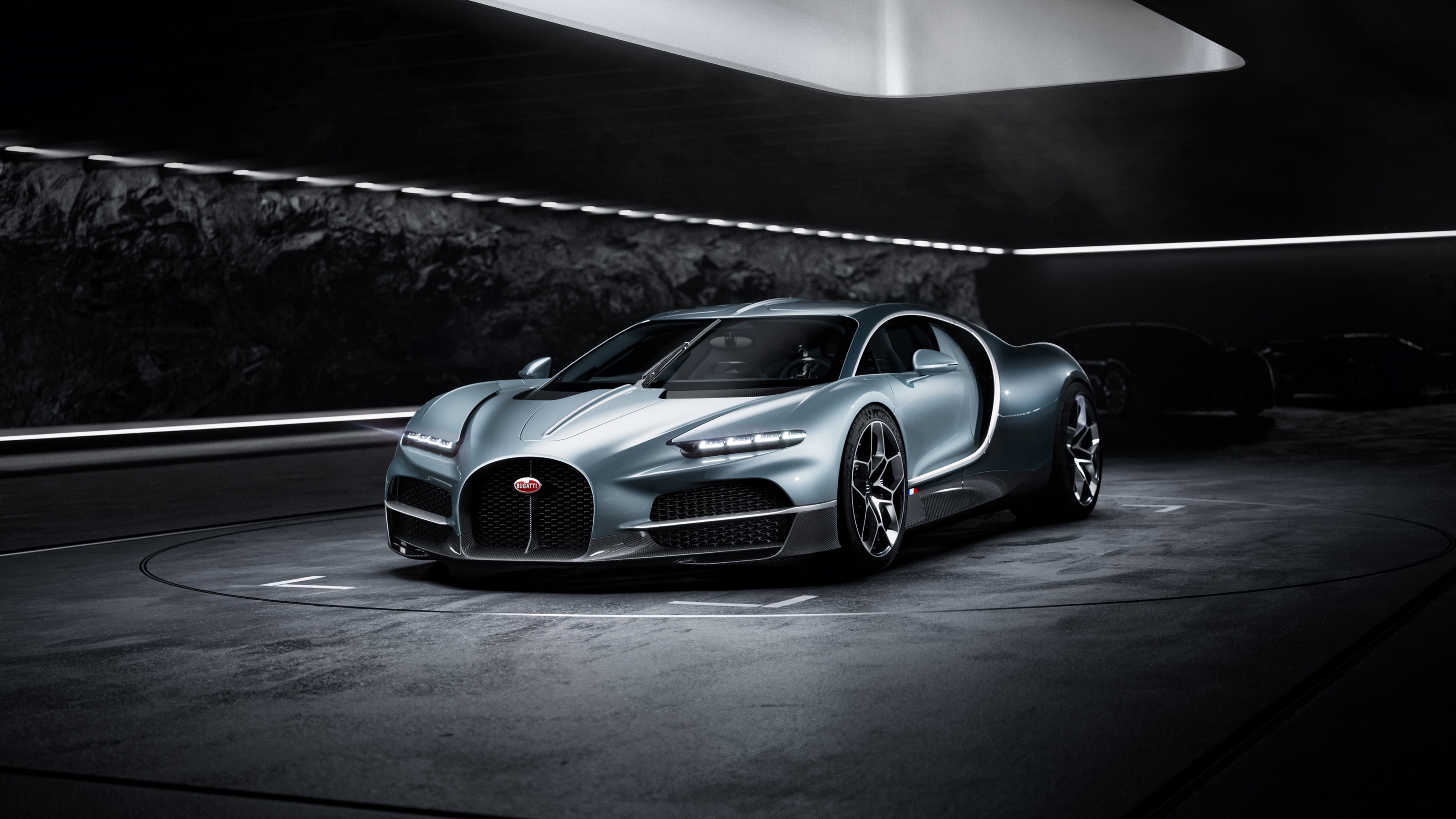 High-resolution close-up of the Bugatti Tourbillon hybrid sports car showcasing its modern aerodynamic design and sleek metallic finish.