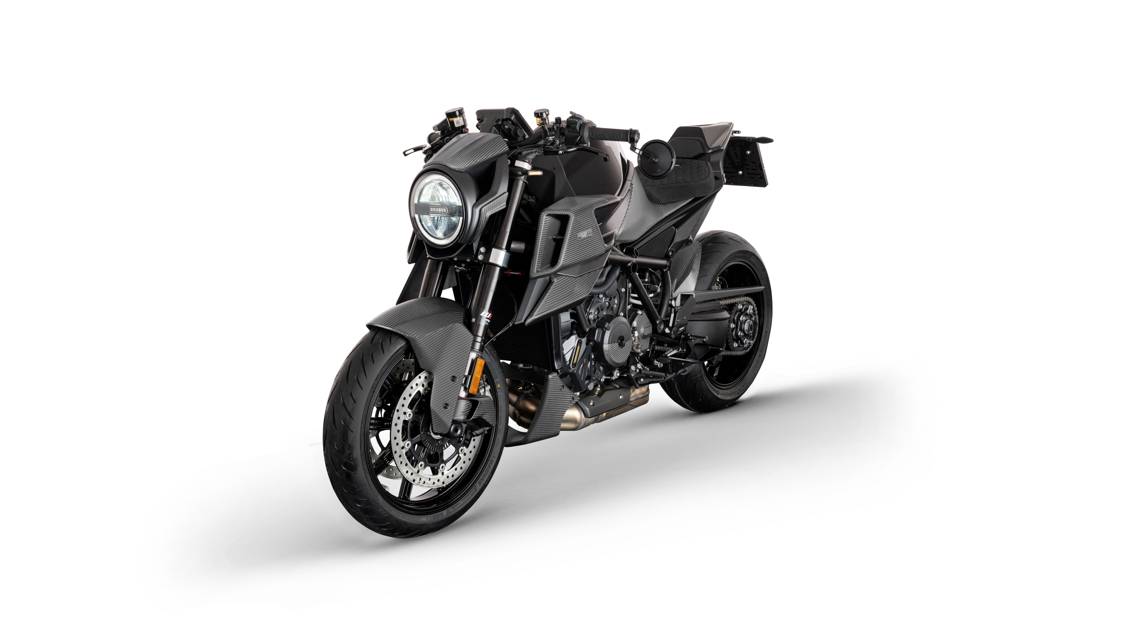 High-detail studio shot of KTM 1290 Super Duke R EVO and Brabus 1300 R Edition 23 motorcycles on a white background