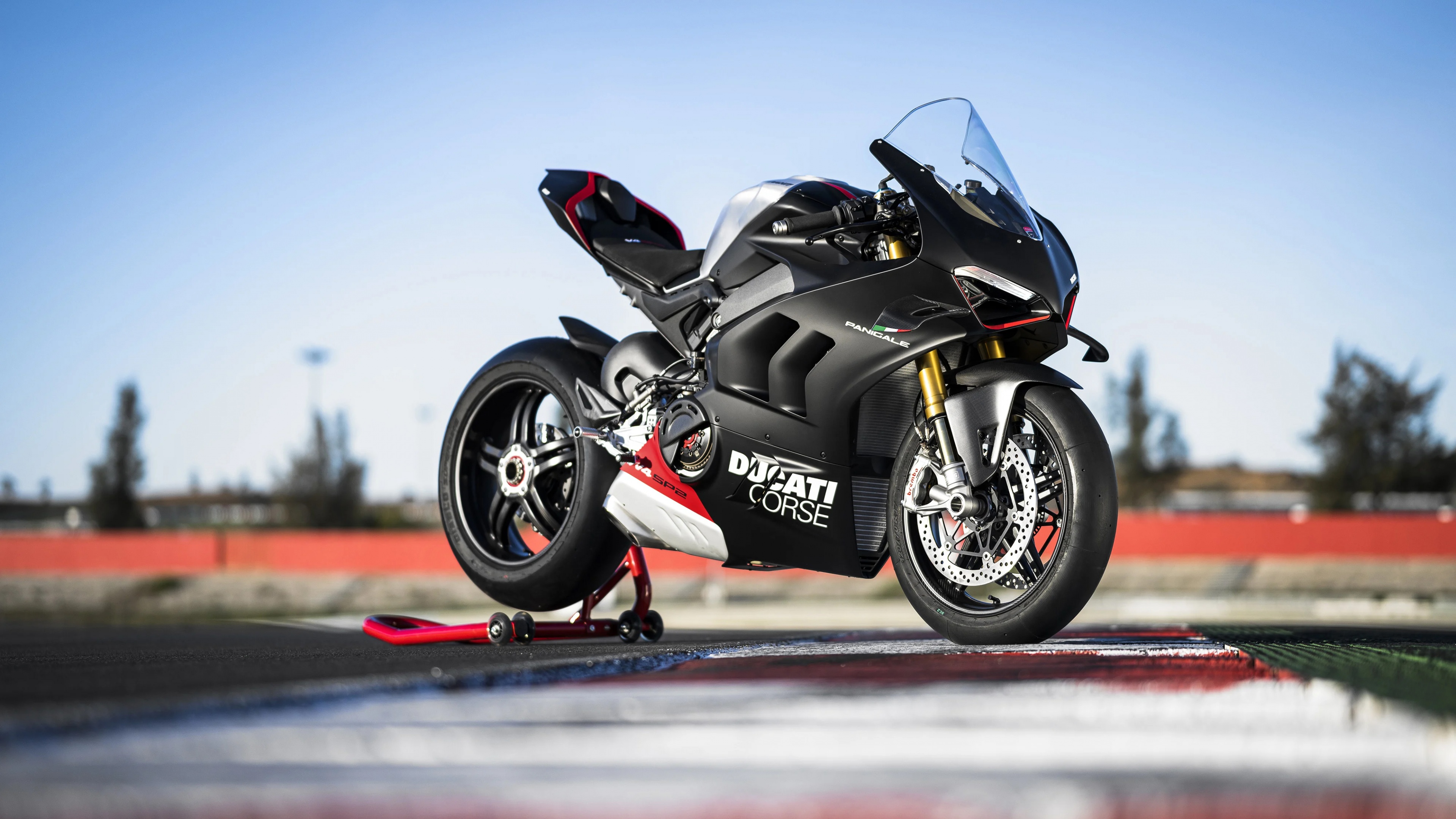 Detailed view of a 2023 Ducati Panigale V4 SP2 sports motorcycle with sleek aerodynamic lines and premium racing aesthetics.