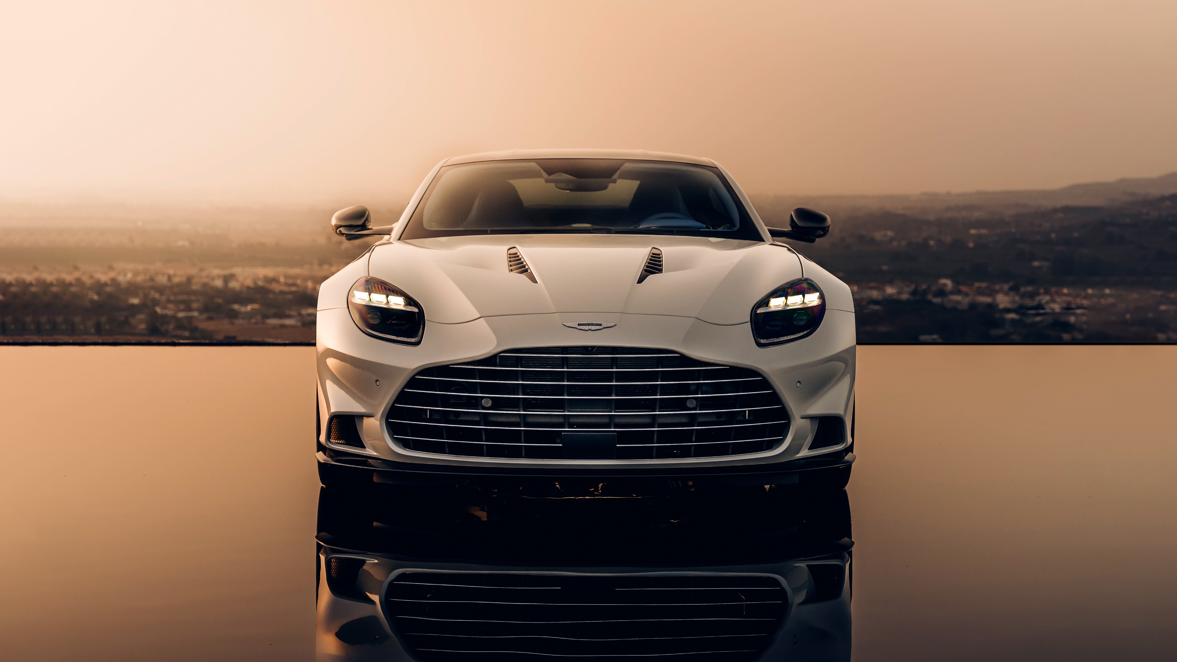 A high-resolution, detailed shot of a 2024 Aston Martin Vanquish luxury sports car.