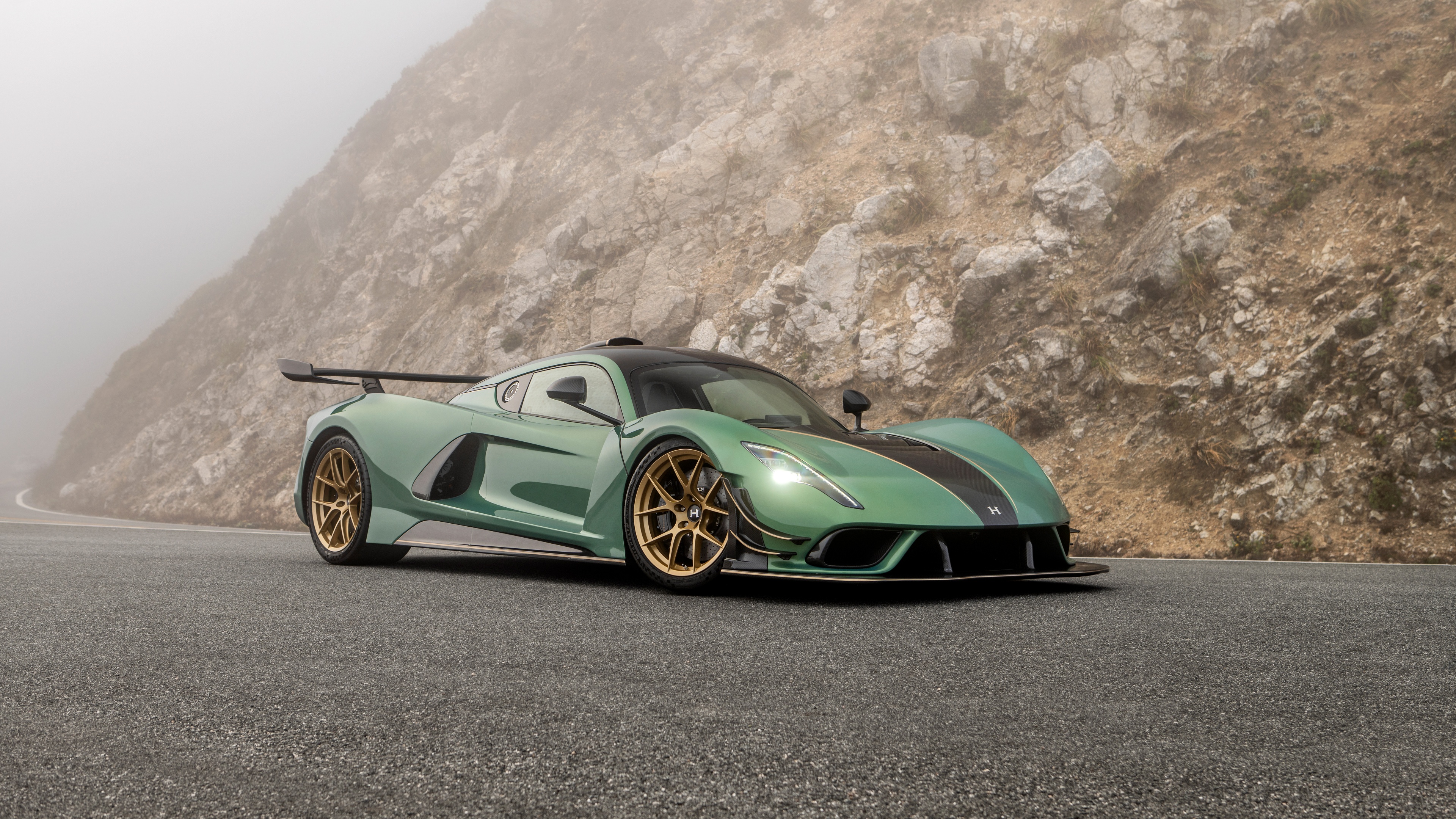 A cinematic, high-resolution shot of the matte black 2024 Hennessey Venom F5 Stealth Edition hypercar.