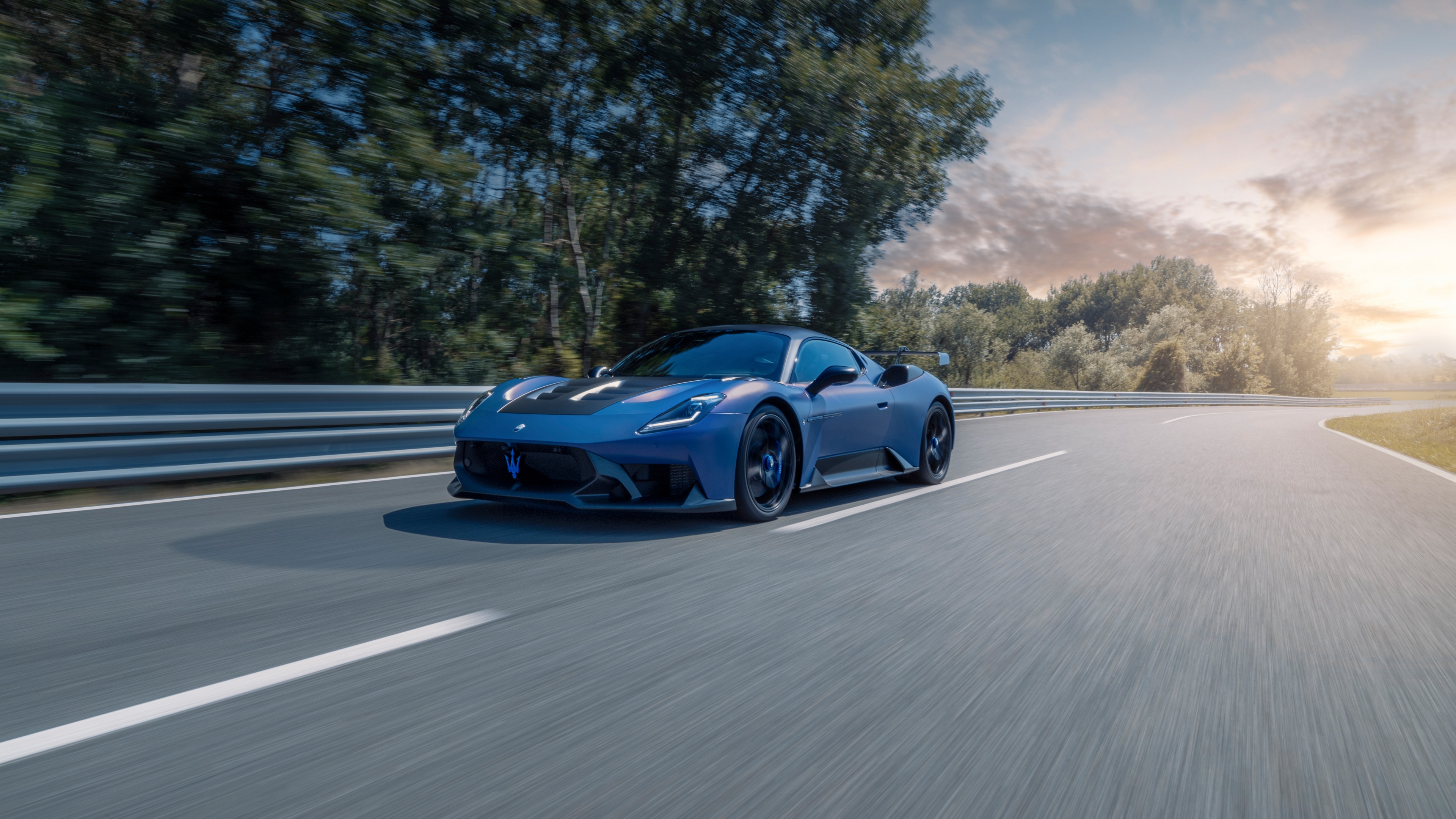 A high-detail, cinematic shot of the 2024 Maserati GT2 racing car highlighting its aerodynamic features.