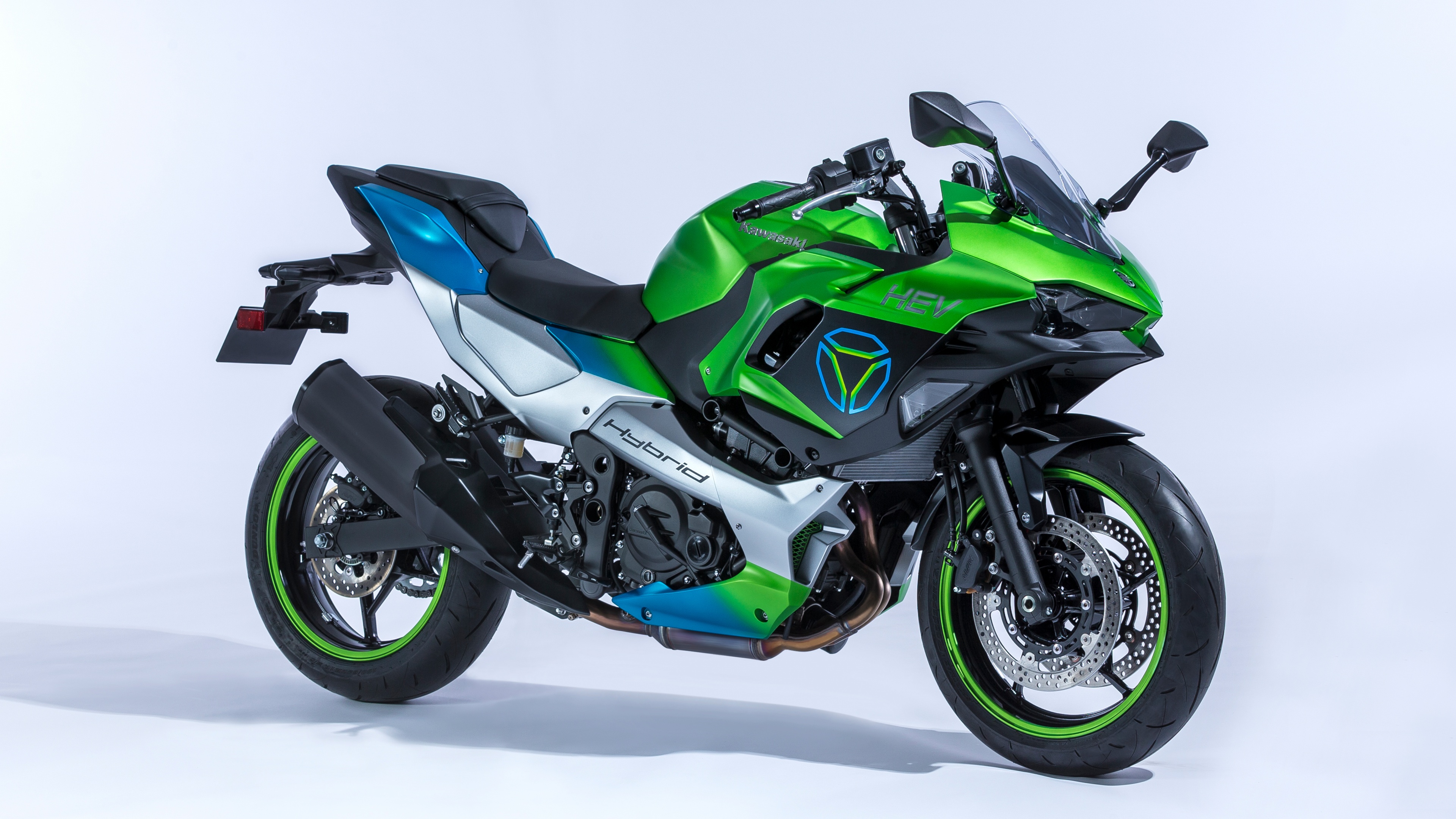 A sleek Kawasaki Ninja HEV hybrid electric sports motorcycle isolated on a white background.