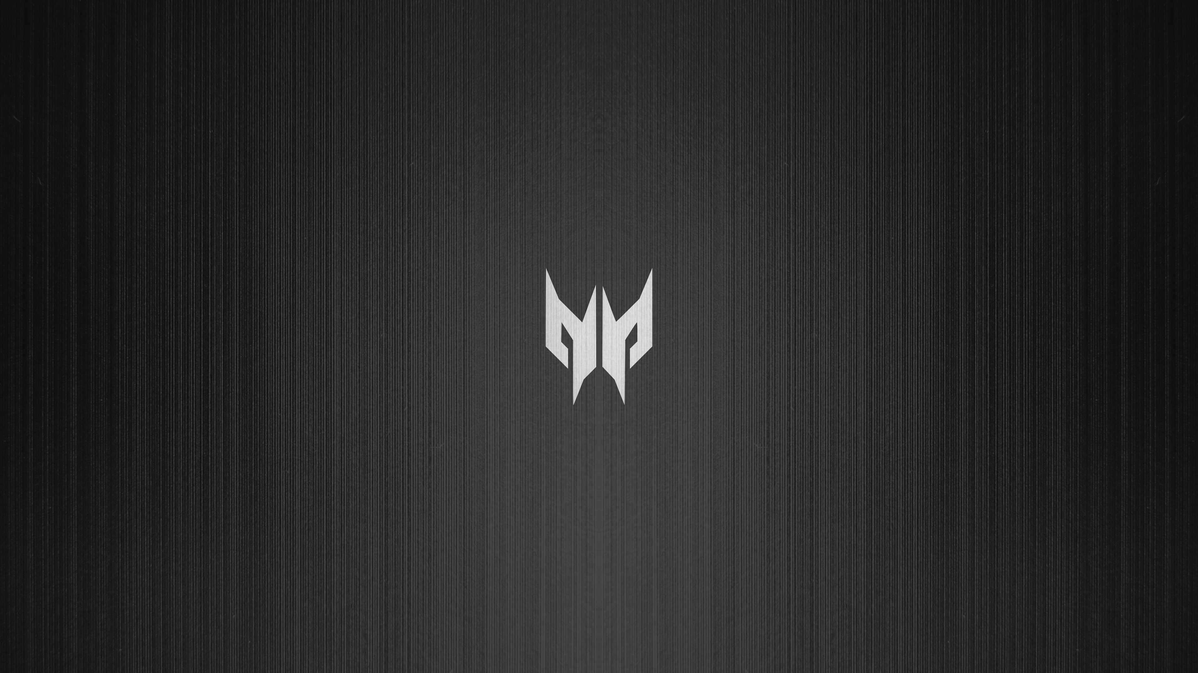 A close-up shot of an Acer Predator gaming laptop featuring a minimalist design on a dark, moody background.