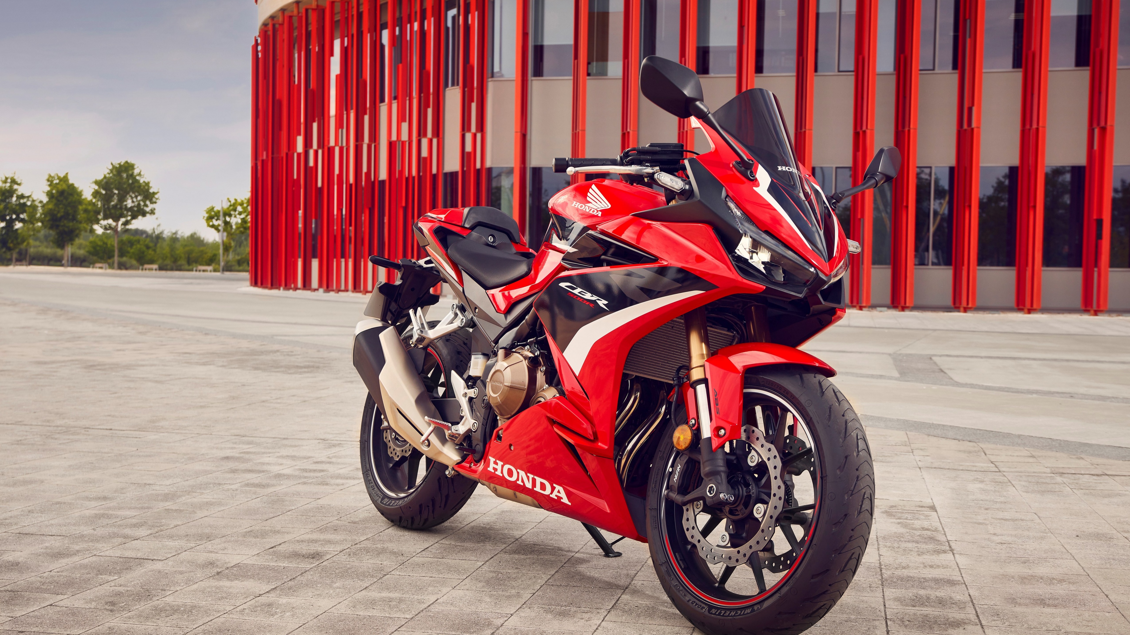 A high-detail, close-up shot of a 2022 Honda CB500R sport motorcycle showcasing its aggressive design.