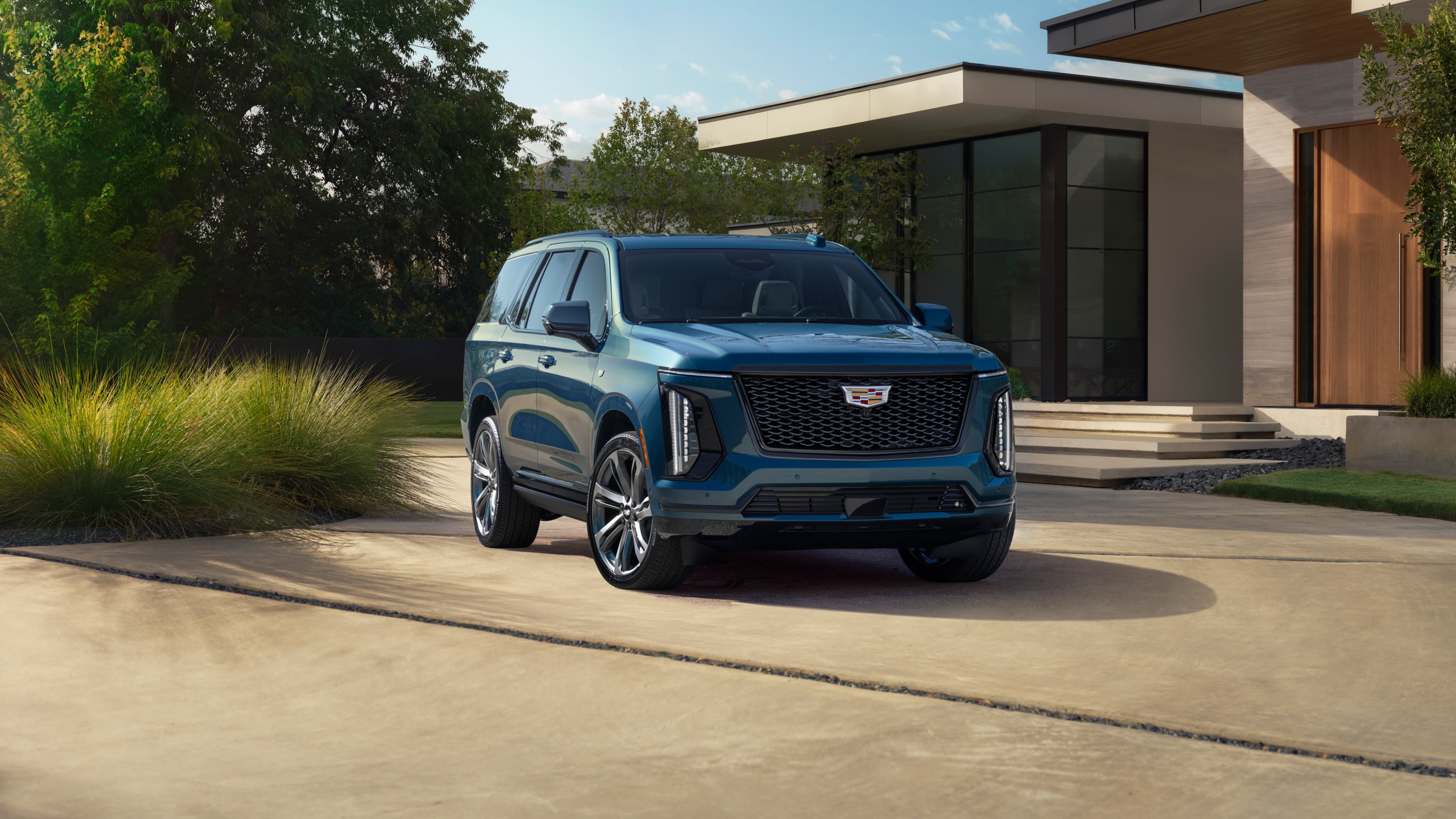 A high-resolution shot of the 2025 Cadillac Escalade luxury SUV parked outdoors.