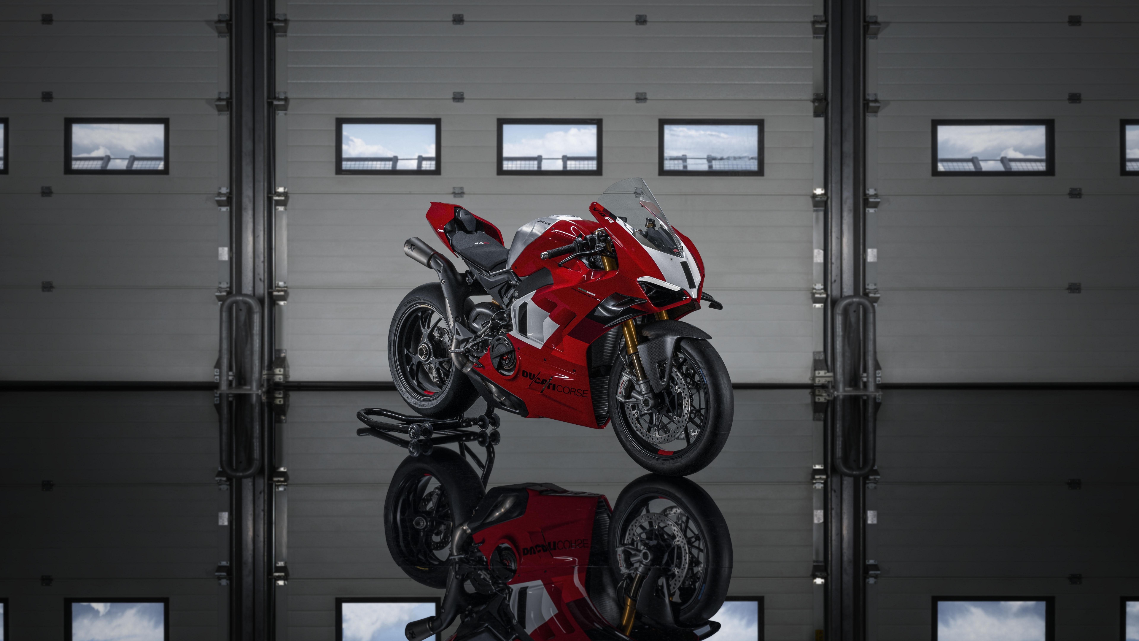 A highly detailed shot of the red 2023 Ducati Panigale V4 R sport motorcycle.