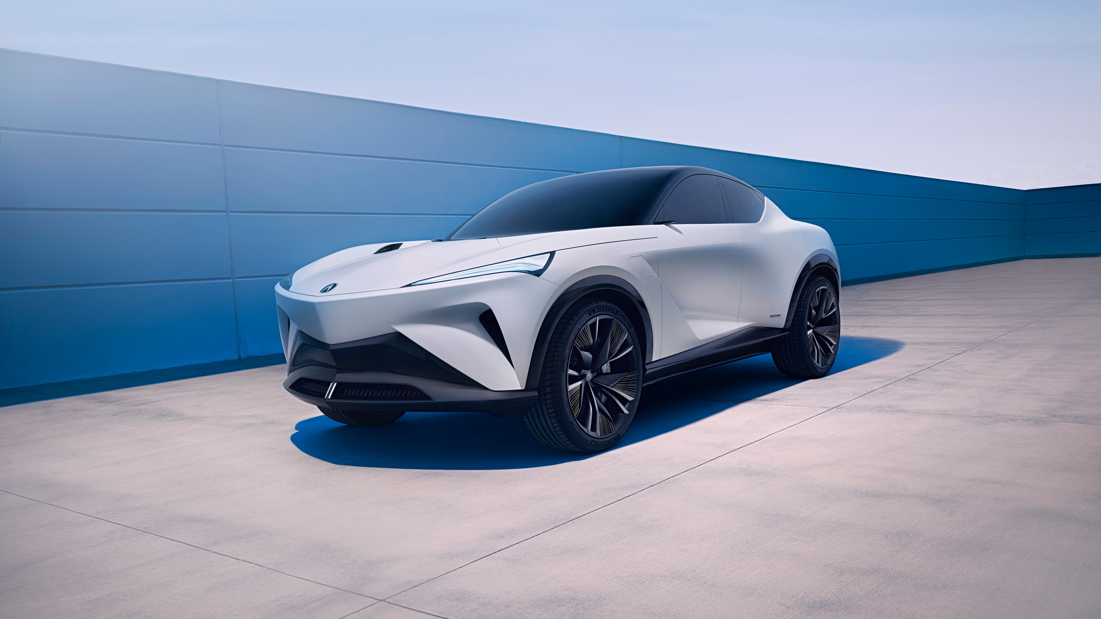 A futuristic 2024 Acura electric crossover concept car featuring sleek, modern lines and advanced automotive design.