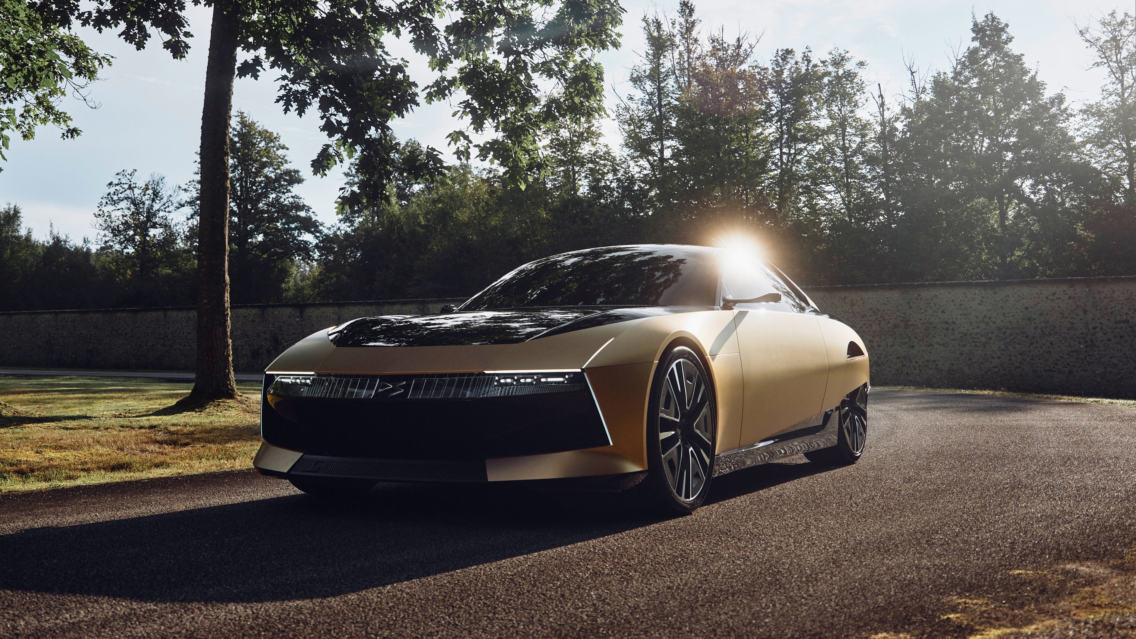 A sleek, aerodynamic 2024 concept car with a futuristic design and metallic body.