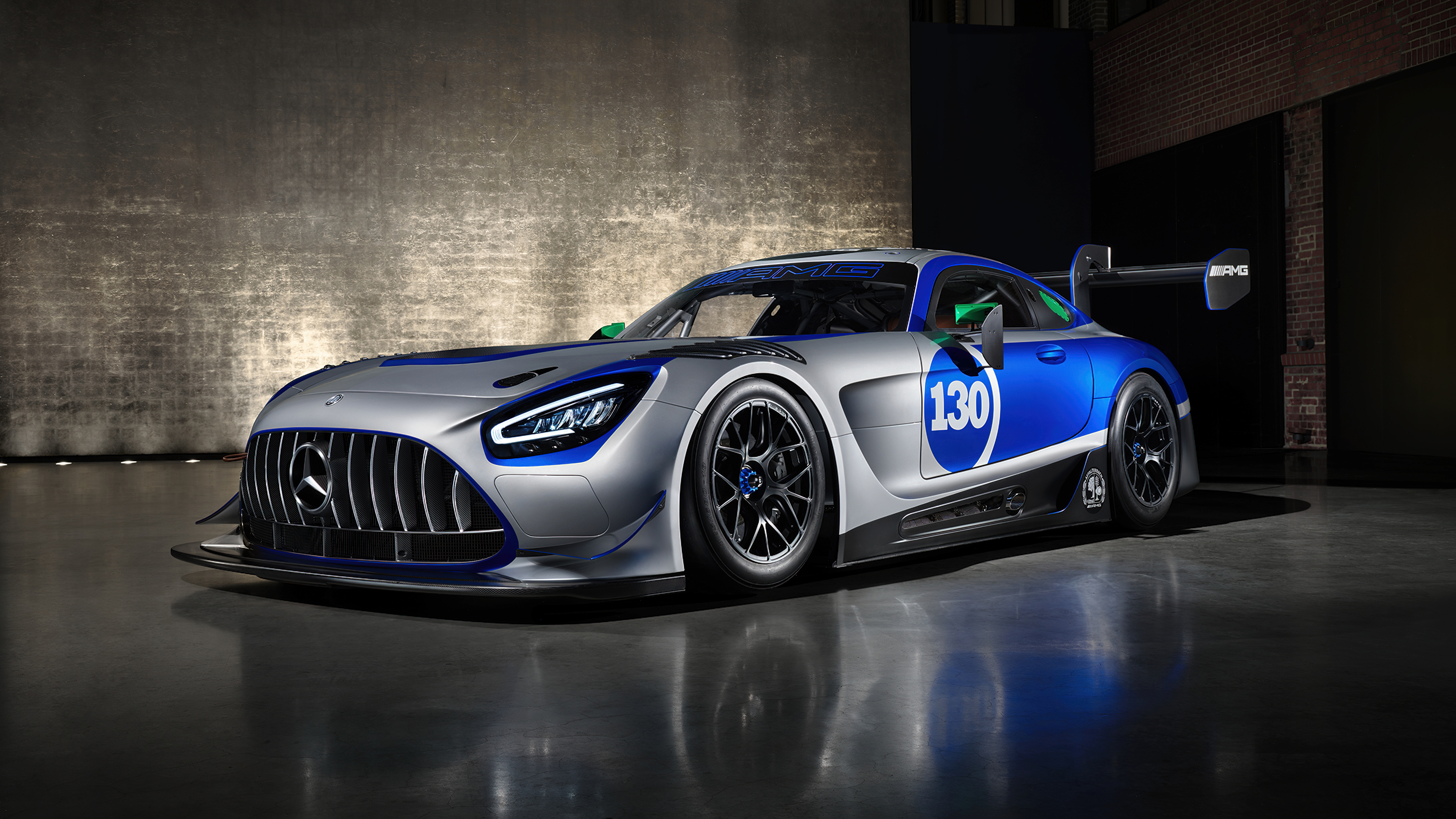 A high-performance 2024 Mercedes-AMG GT3 race car featuring aerodynamic spoilers and professional motorsport styling.