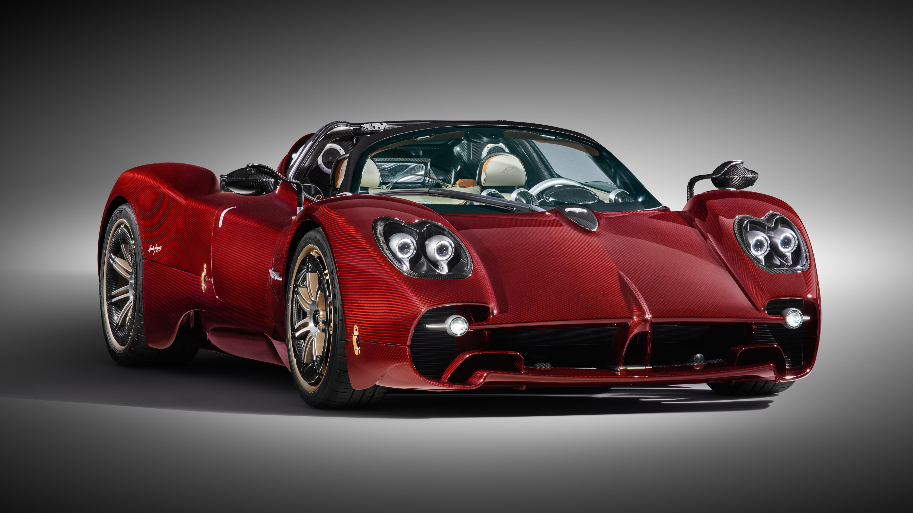 A high-detail, cinematic view of the sleek and aerodynamic 2024 Pagani Utopia Roadster hypercar.