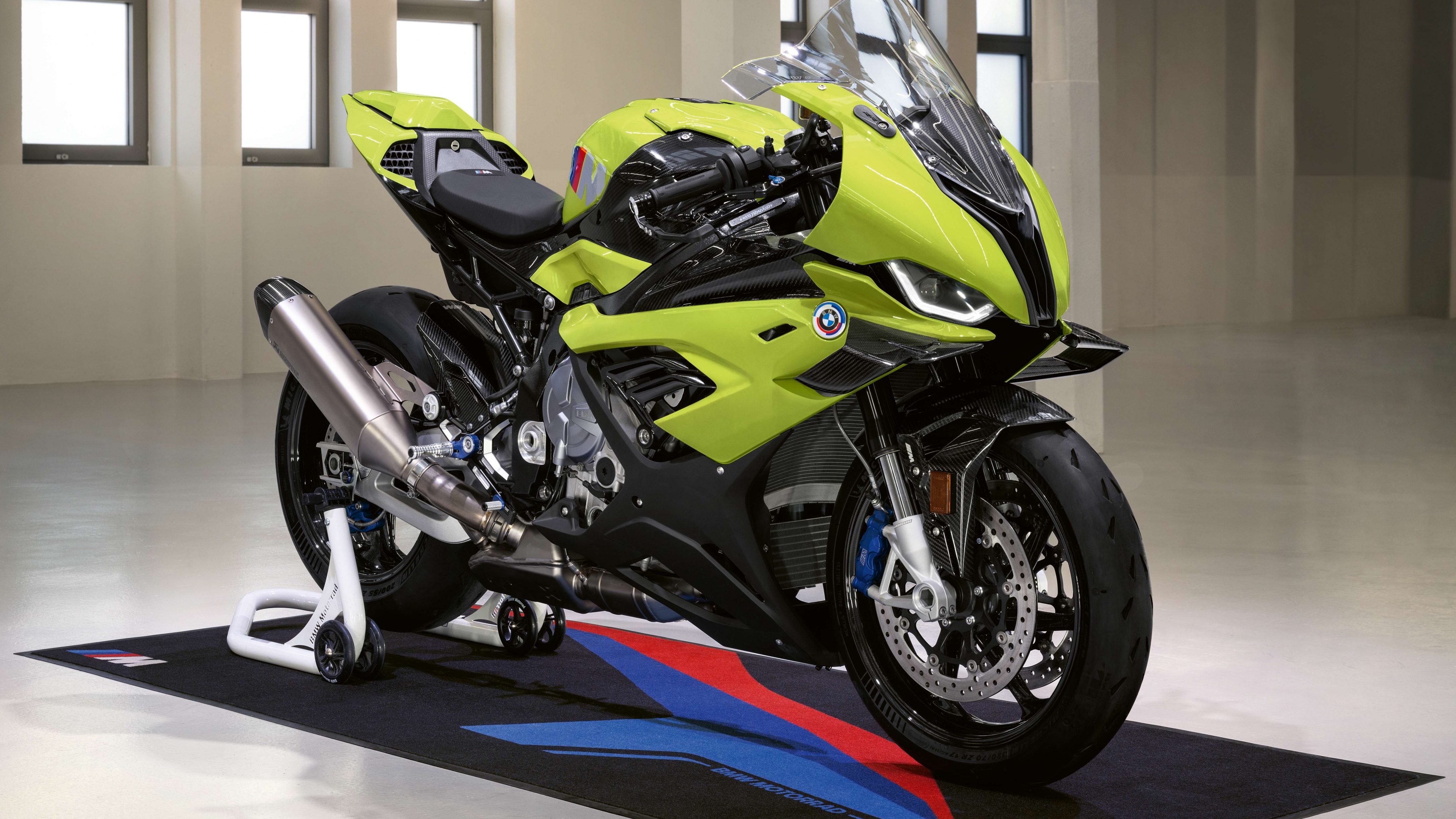 A detailed view of the BMW M 1000 RR 50th Anniversary edition superbike, highlighting its sleek sports bike architecture and premium finish.
